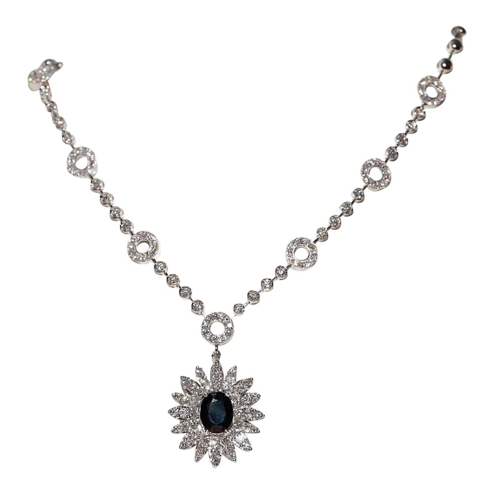 Collana decorata con diamanti naturali e zaffiri in oro bianco 18 carati