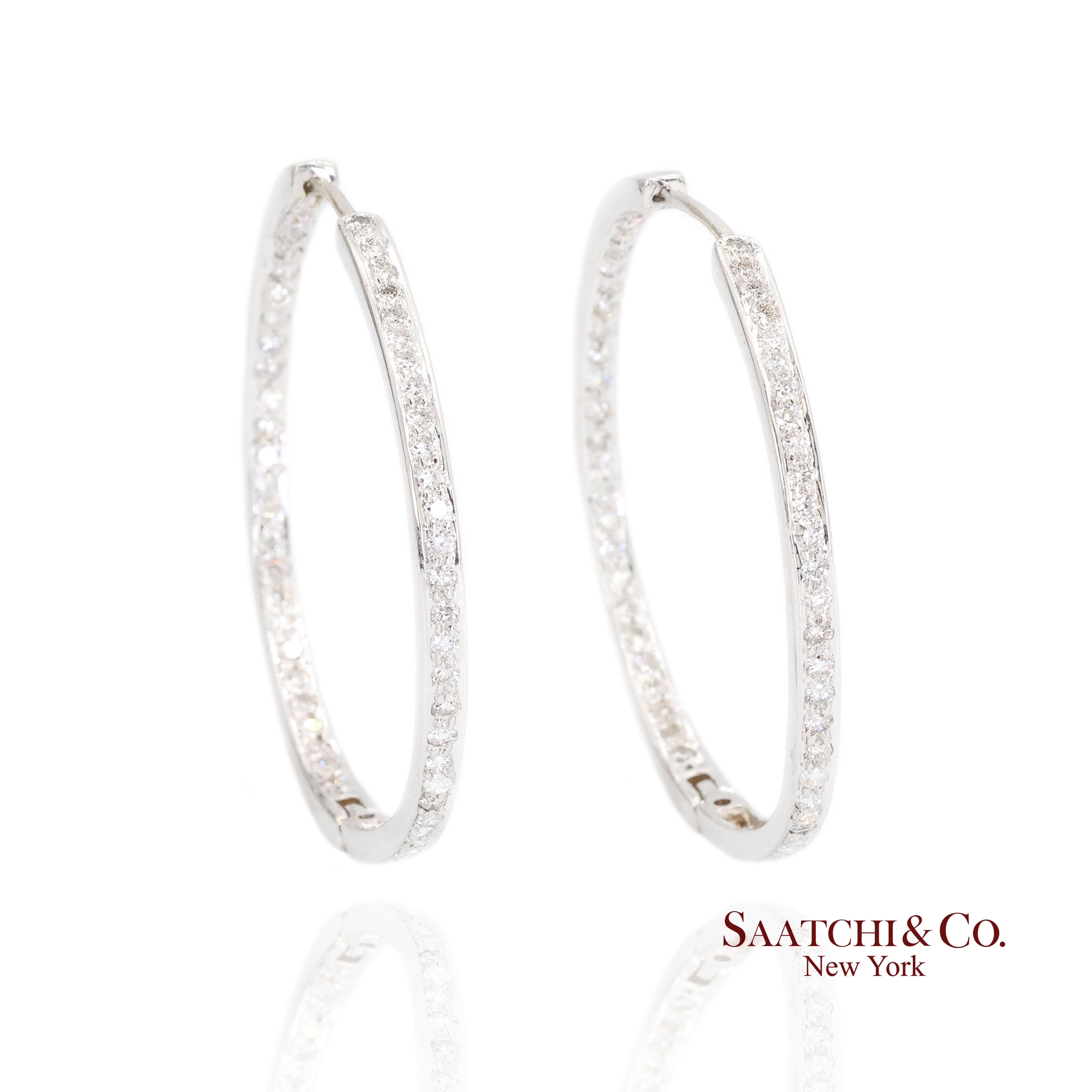 Diamond Hoop Earrings
Metal Type: 18k White Gold
Total Item Weight: 6.7 Grams
Dimensions: 32.8 mm x 32.3 mm x 2.25 mm

1:
Primary Stone: Diamond
Carat Weight: 1.5 Ct. (62 Pcs)
Stone Color: White
Stone Cut: Round Full Cut
Diamond Clarity: Slightly