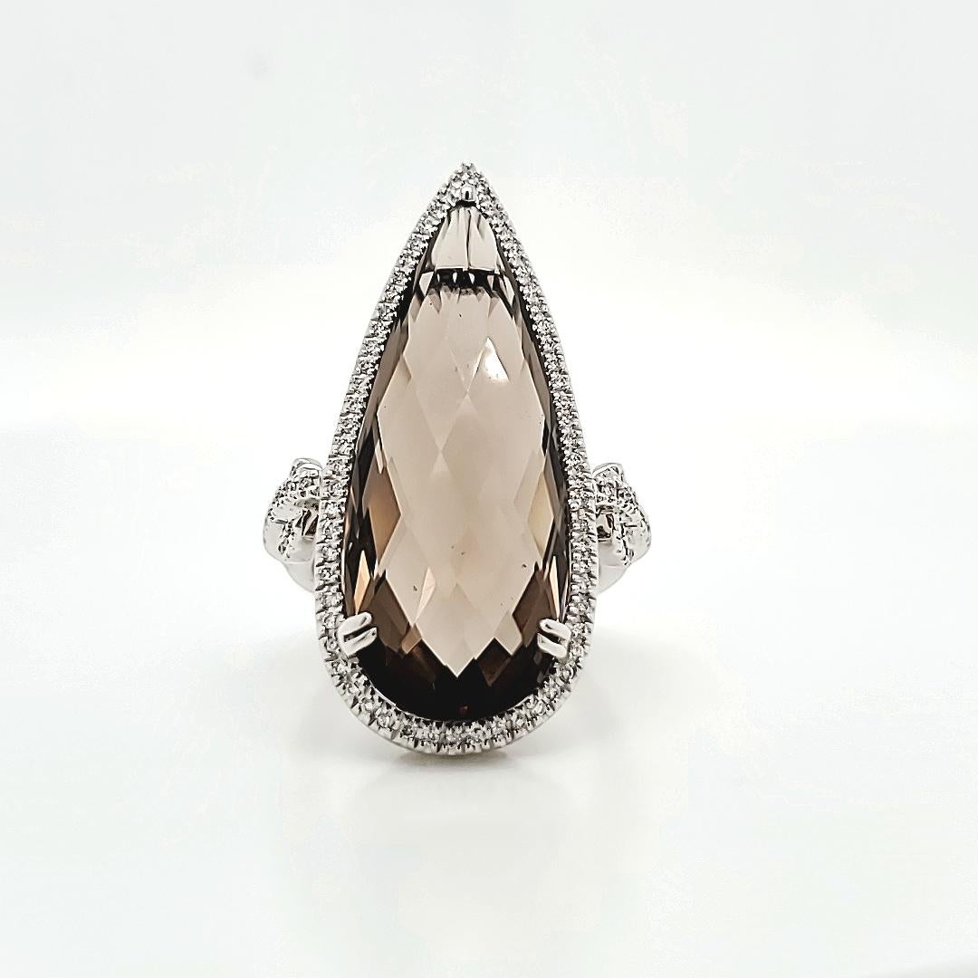 18k White Gold Natural Smoky Quartz Marquise Diamond Ring

This masterpiece is crafted from high-quality 18k white gold, weighing a substantial 9.05 grams.

This choice of metal not only emanates luxury but also guarantees durability, making it a