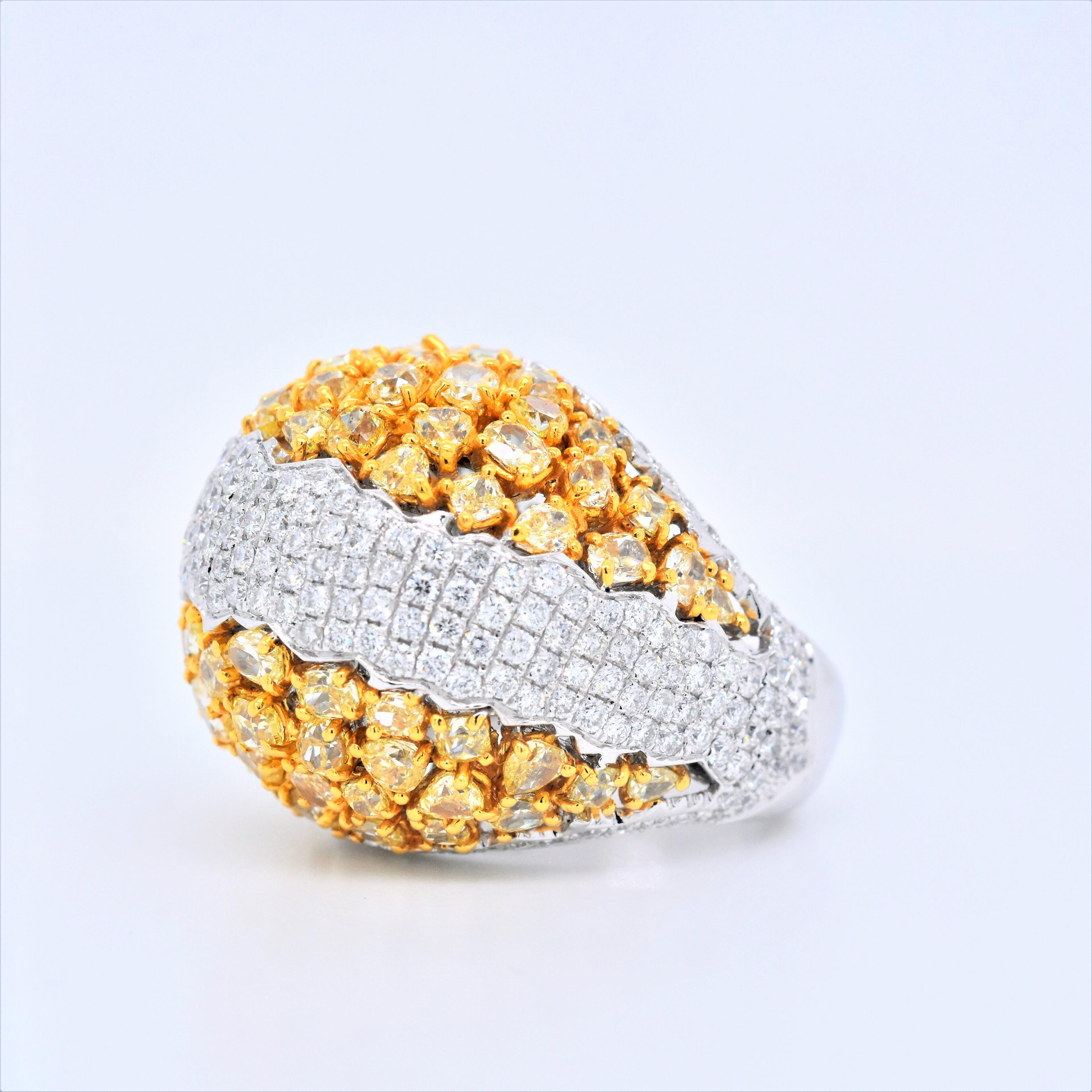 One of a Kind 8.87 Carat Natural Fancy Yellow Diamond Ring with Middle Part Wave of White Diamonds
Total Carat Weight: 8.87
Mixed Cut Natural Fancy Yellow Diamond: 6.19 Carats (total 70 stones)
Round White Diamonds: 2.68 Carats (total 233