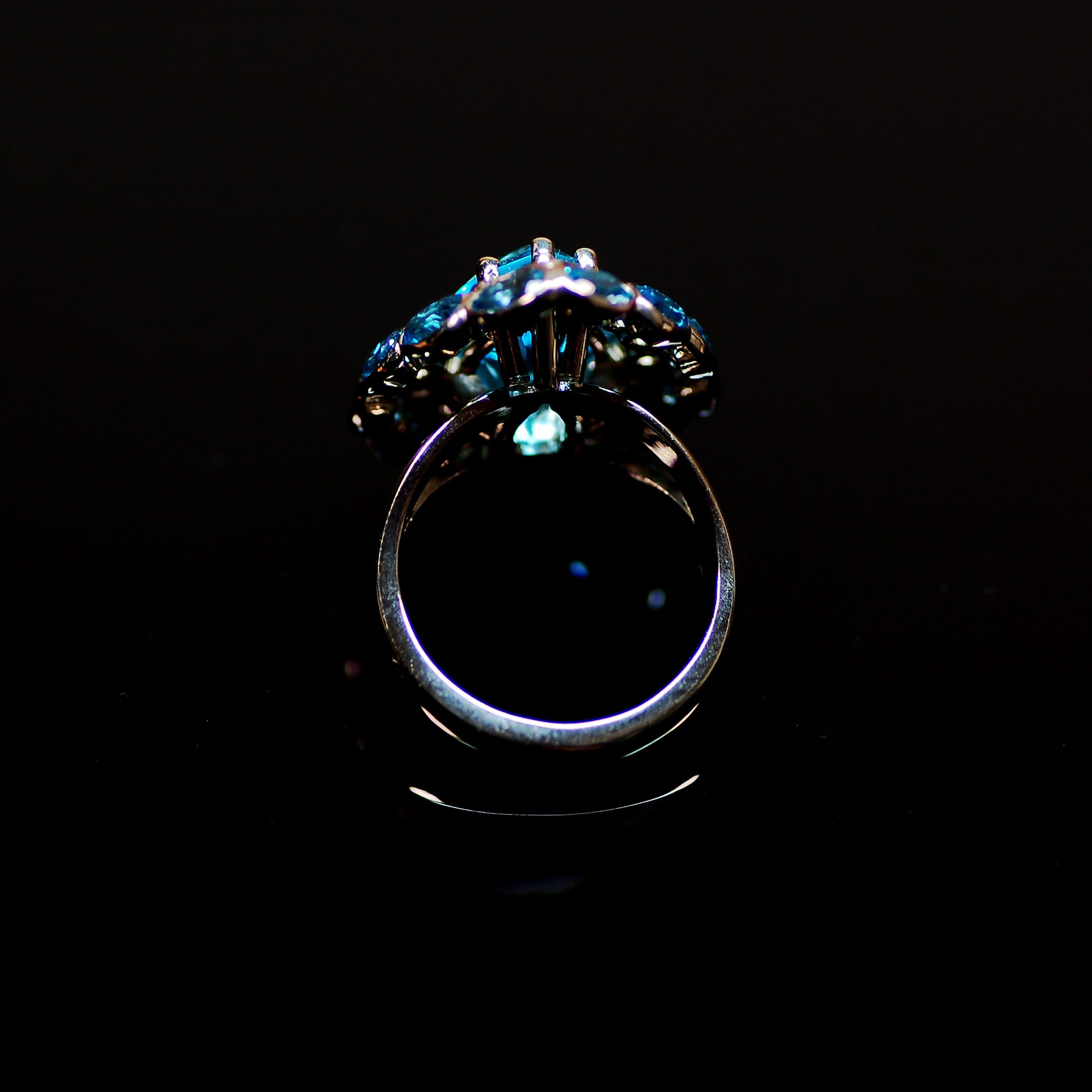 Large cocktail ring in 18K white gold set with aquamarines (15.6ctw), and diamonds (1.3ctw). A substantial piece for a person of confidence and refinement.

Styled after a ring belonging to George III (circa 19th century), this piece was created for