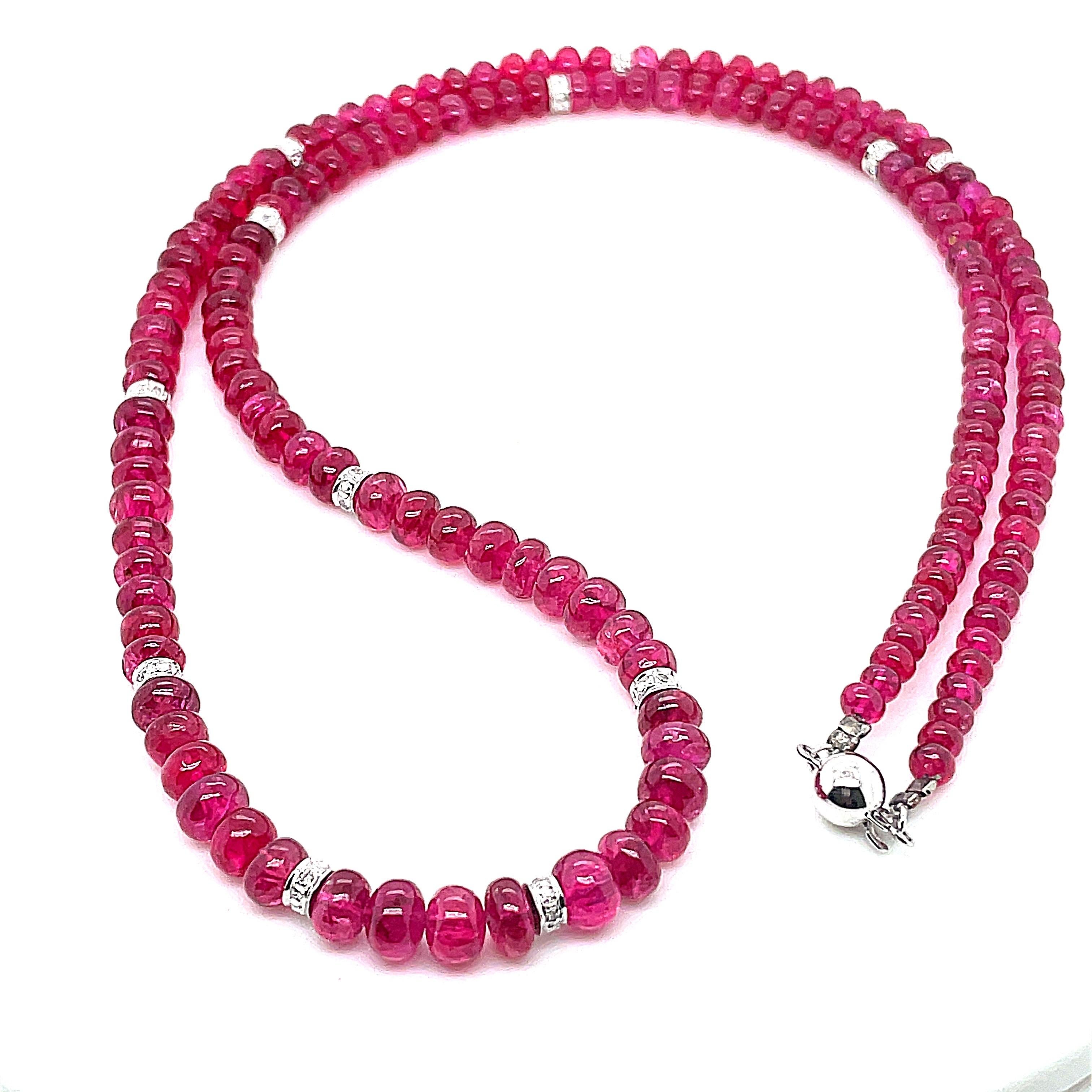 Draped in 122.48 carats of unheated spinel beads, this necklace is a celebration of natural allure. 

Each bead whispers tales of authenticity, as no heat treatments have altered their breathtaking hues.

Between these spinel beads, threads of white