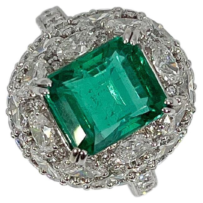 18K White Gold Octagon Step Cut 4.48 CT Emerald and Diamond Ring For Sale
