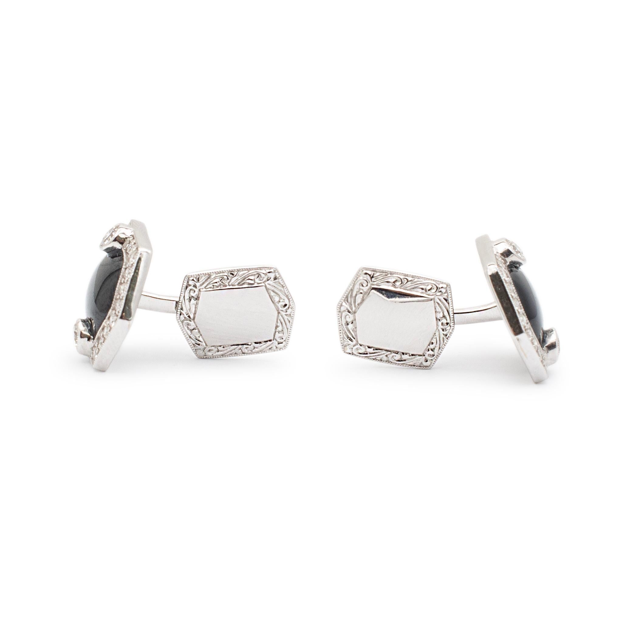 Gender: Unisex

Metal Type: 18K White Gold

Length: 0.75 mm

Width: 18.45 mm

Weight: 12.90 grams

One pair 18K white gold diamond and onyx cufflinks.  Engraved with 