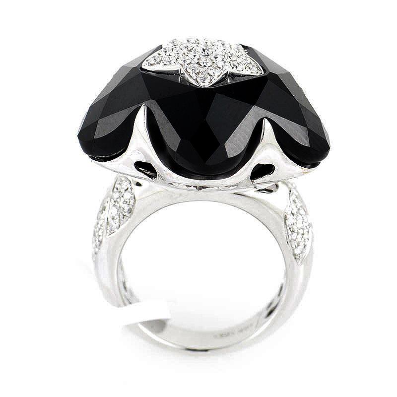 This ring is playful and unique. The rings is made of 18K white gold and boasts an onyx accent shaped like a star. Lastly, the star and shanks are partially set with ~.82ct of diamonds.
Ring Size: 6.5