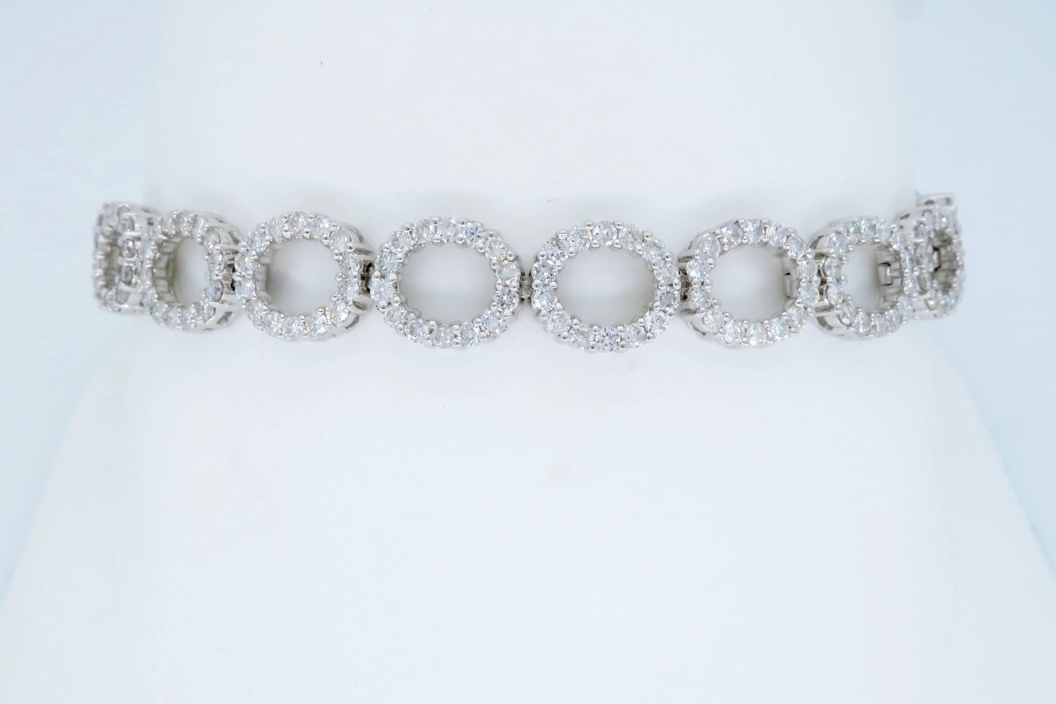 This stunning 18k White Gold bracelet features 270 Round Brilliant Cut Diamonds; the featured diamonds display an average color of G-I and average clarity of SI-I. There is approximately 4.07CTW of diamonds in this bracelet. The bracelet is 6.5” in