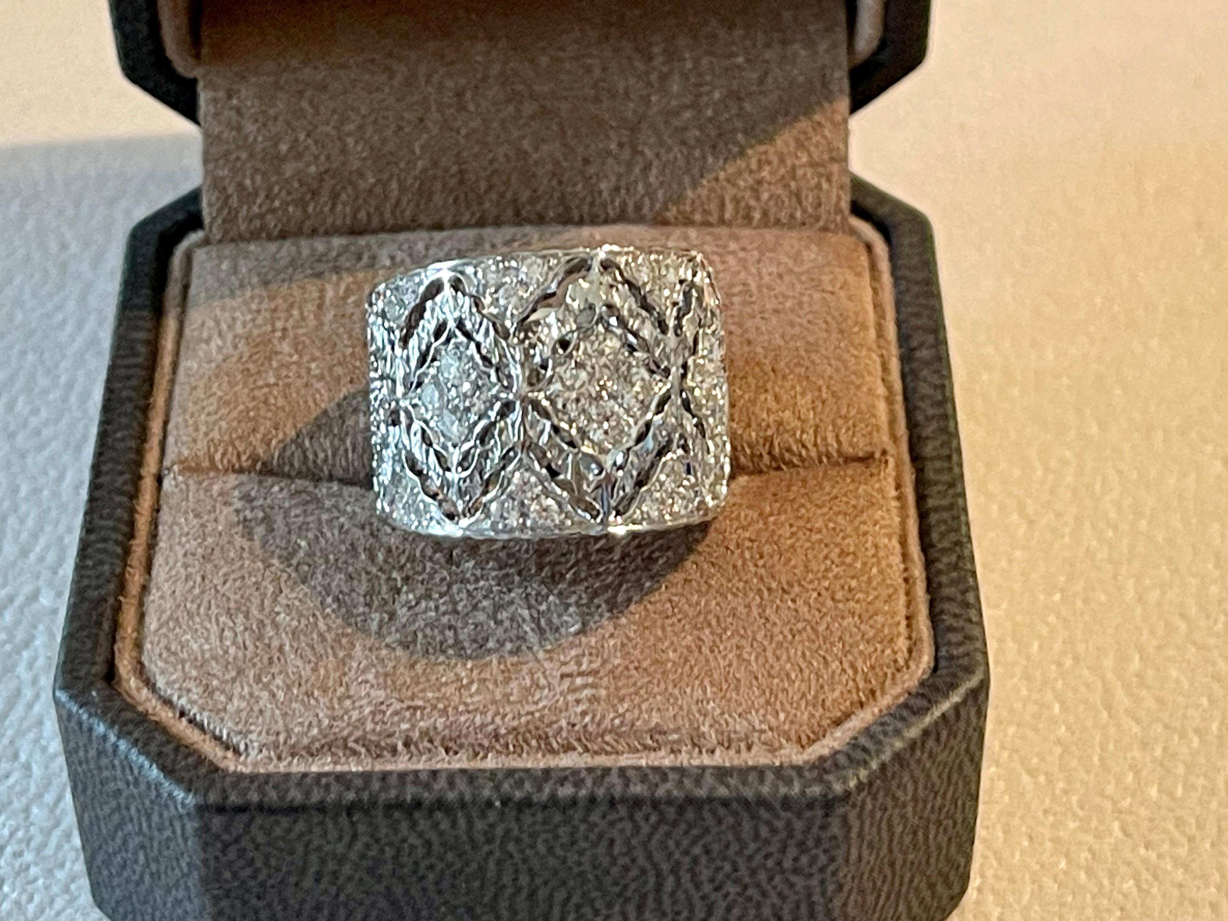 This stunning and elaborate openwork and filligree band ring features 36 brillinat cut Diamonds weighng 0.88 ct. G color, vs clarity. 
Show her you love her with this romantic diamond filigree anniversary ring. This scintillating openwork filigree