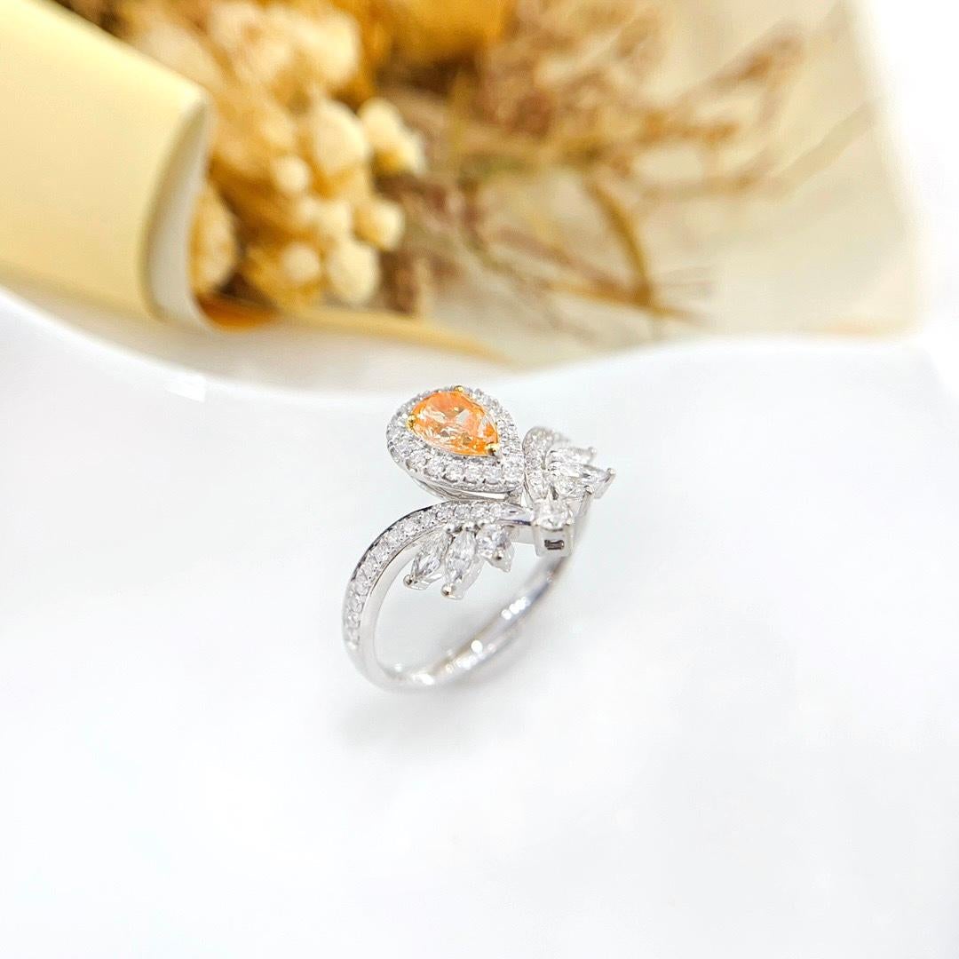 Modern 18K White Gold Orange Diamond & Pear-Cut Diamond Crown Ring For Sale