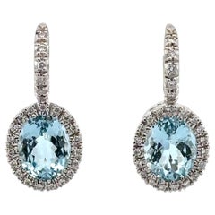 Boucles d'oreilles pendantes en or blanc 18k aigue-marine ovale diamant halo à levier