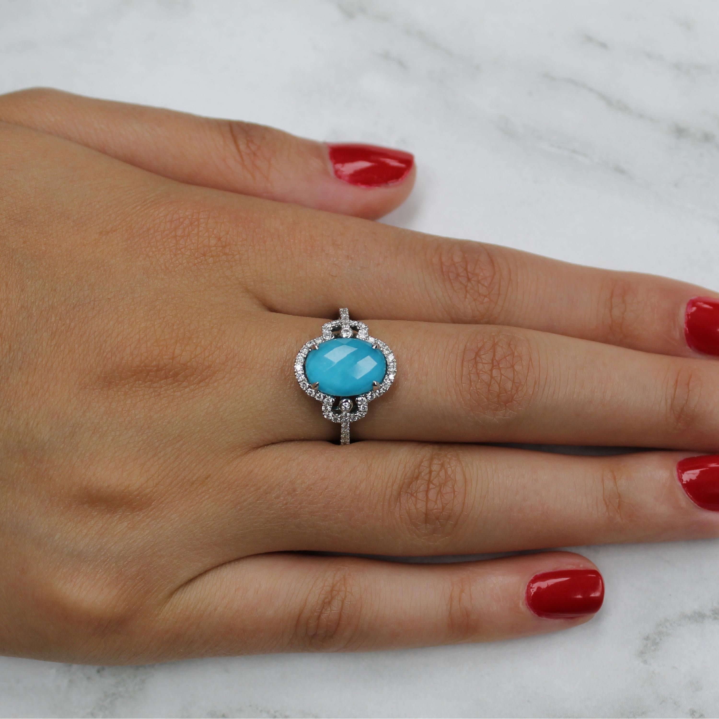 St. Barths Blue Ring featuring an oval, checker-cut, White Topaz layered with Natural Arizona Turquoise, surrounded by diamonds. The St. Barths Blue collection from Doves by Doron Paloma takes you to the crystal clear, turquoise waters of the French