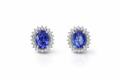 18K White Gold Oval Earrings with Vivid Tanzanite and Diamond Jacket Halo