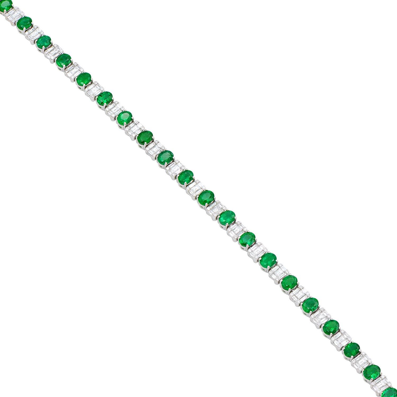 This truly gorgeous emerald and diamond bracelet is made from 21 oval green emeralds totalling 6.5 carats that alternate with diamonds set to look like emerald-cut diamonds. The diamonds are made from 105 baguettes and 84 round diamonds which total
