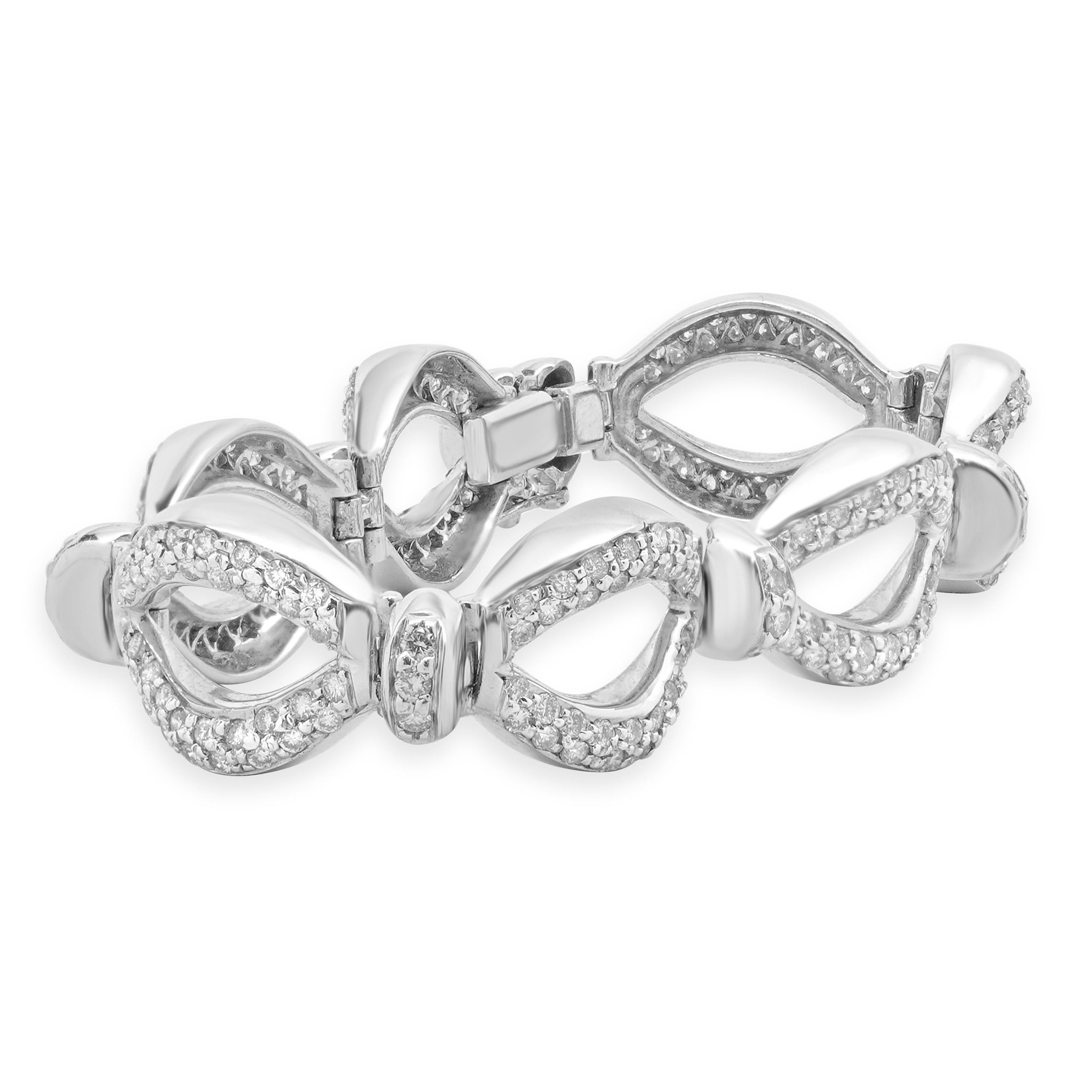 Designer: custom design
Material: 18K white Gold
Diamond: 262 round brilliant cut= 5.24cttw
Color: G
Clarity: SI1
Dimensions: bracelet will fit up to a 7-inch wrist
Weight: 33.26 grams
