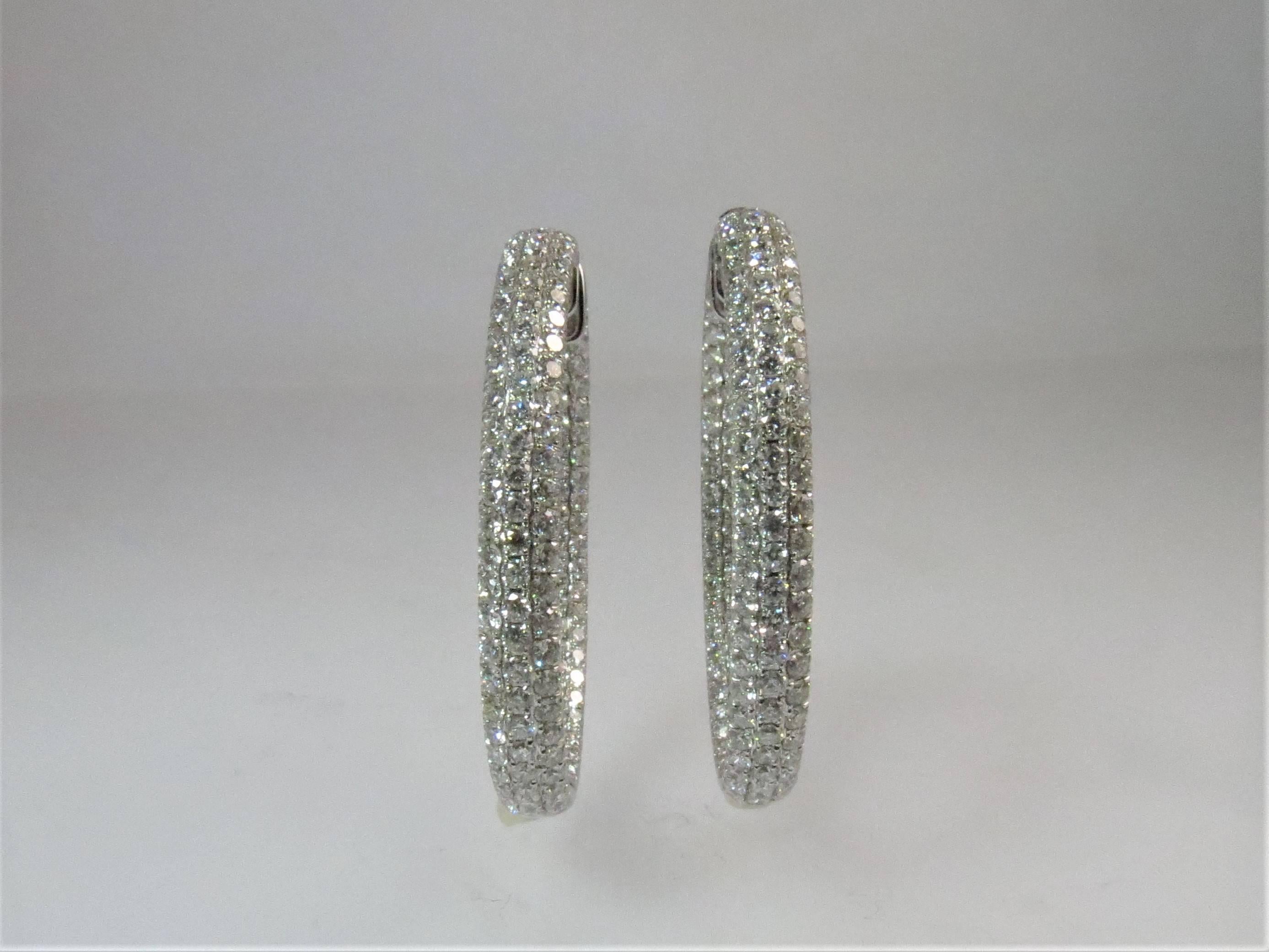 18K white gold oval shape hoop earrings, pave set with 300 full cut round diamonds weighing 8.30cts, G color, VS clarity