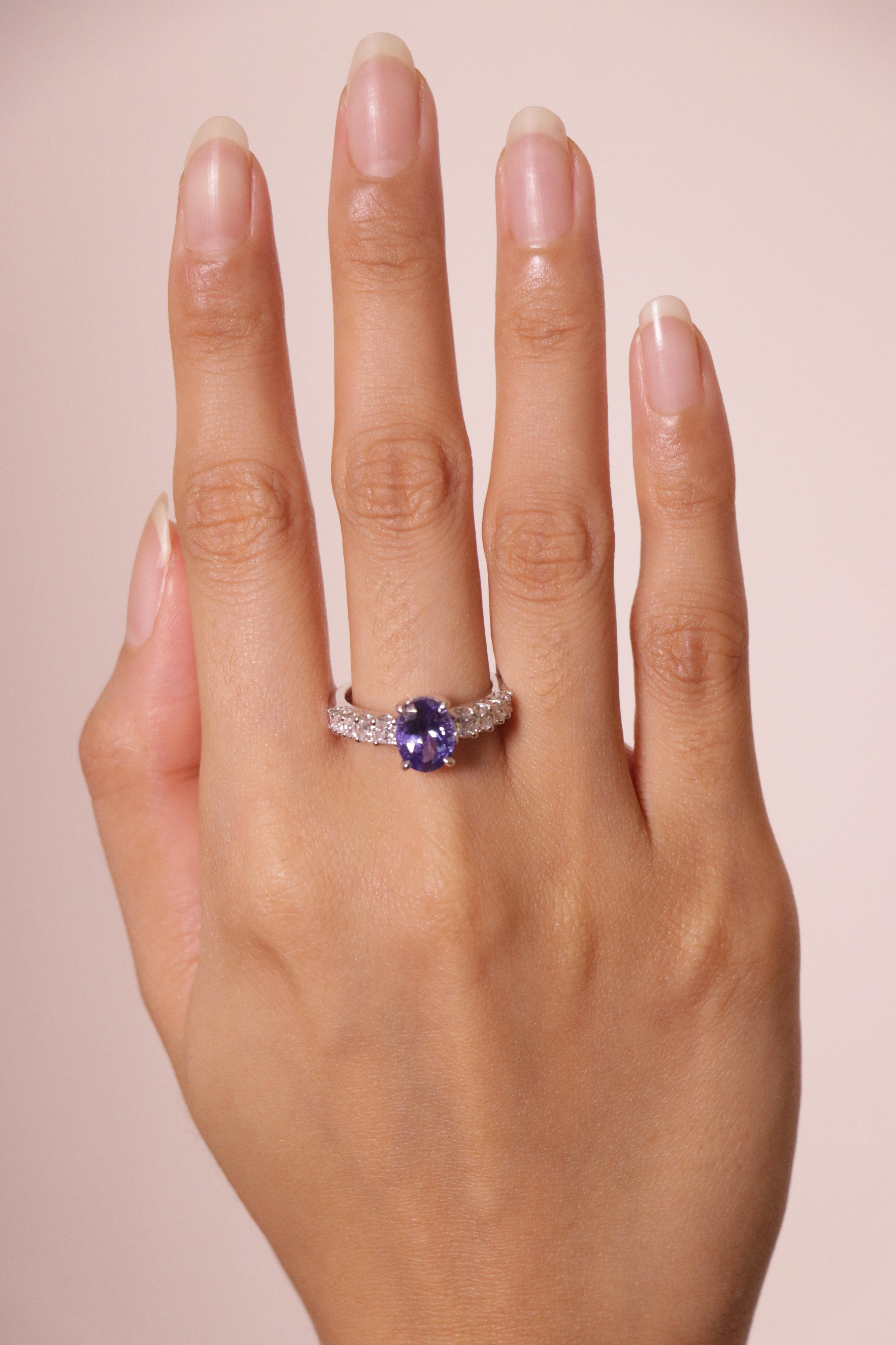Slip into something unforgettable with this exquisite tanzanite engagement ring, where elegance and rarity intertwine.

At its center glows a 2.12-carat oval tanzanite, sourced exclusively from the Merelani Hills of Tanzania. 

Set in 4.32 grams of