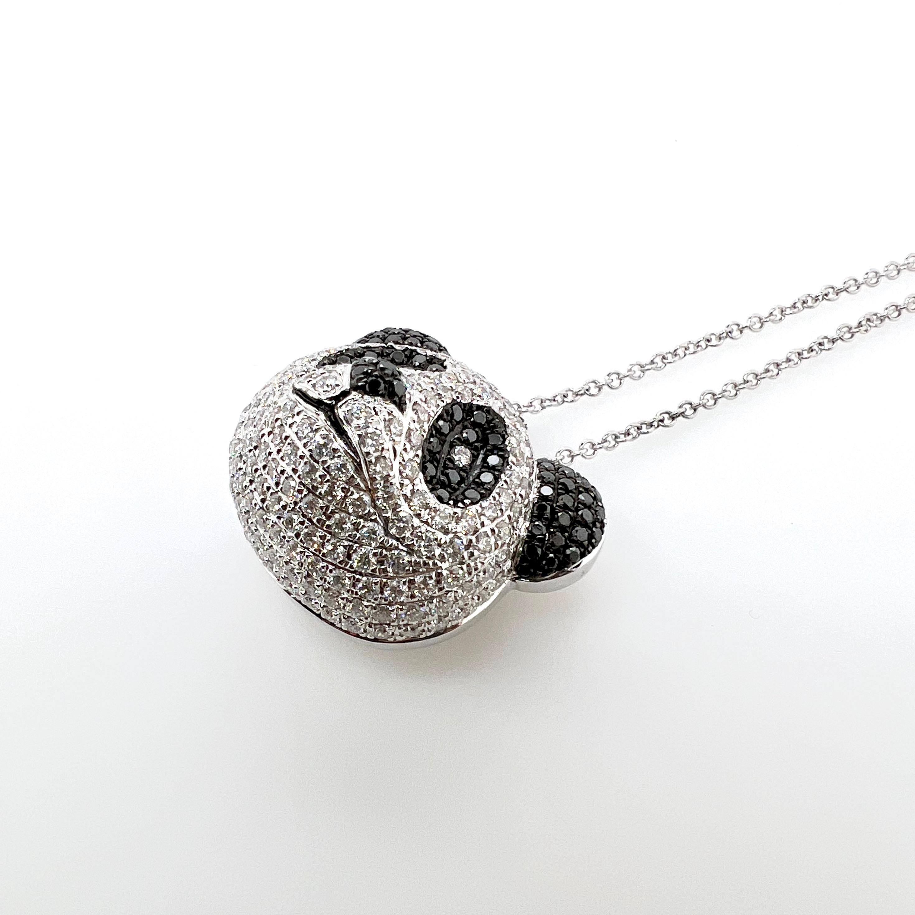 This absolutely fun panda bear will be a novelty and keepsake for generations!  This 18k white gold panda bear is made to mimic the puffy and 3 dimensional look of an actual Panda!  The black and white diamonds outline the facial features of this