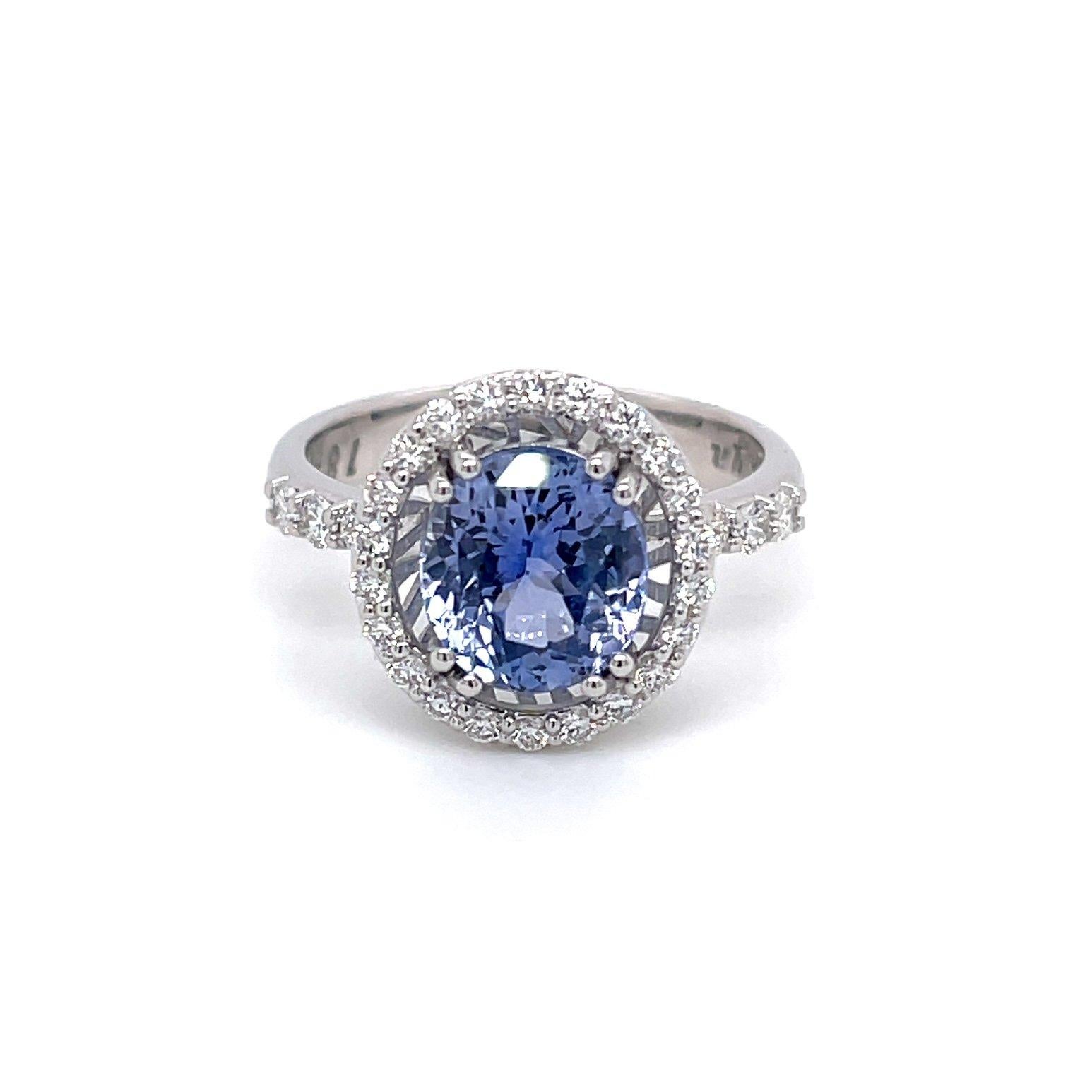 An 18k white gold ring set with one oval 2.95 carat pastel blue sapphire, untreated from Sri Lanka, and .4 carats of white FVS diamonds. This ring was made and designed by llyn strong.