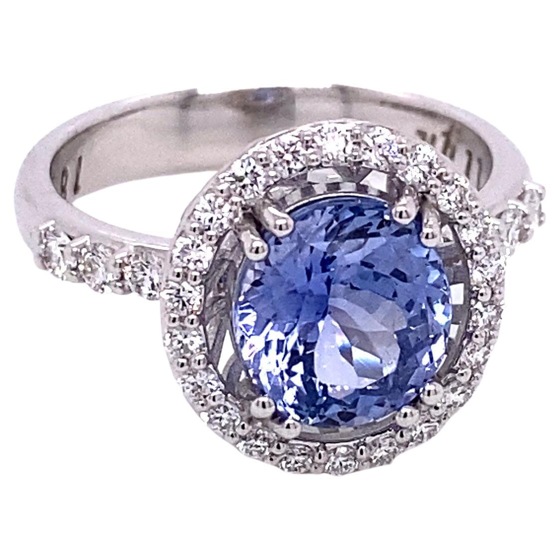 18k White Gold Pastel Blue Sapphire Ring with a White Diamond Halo For Sale