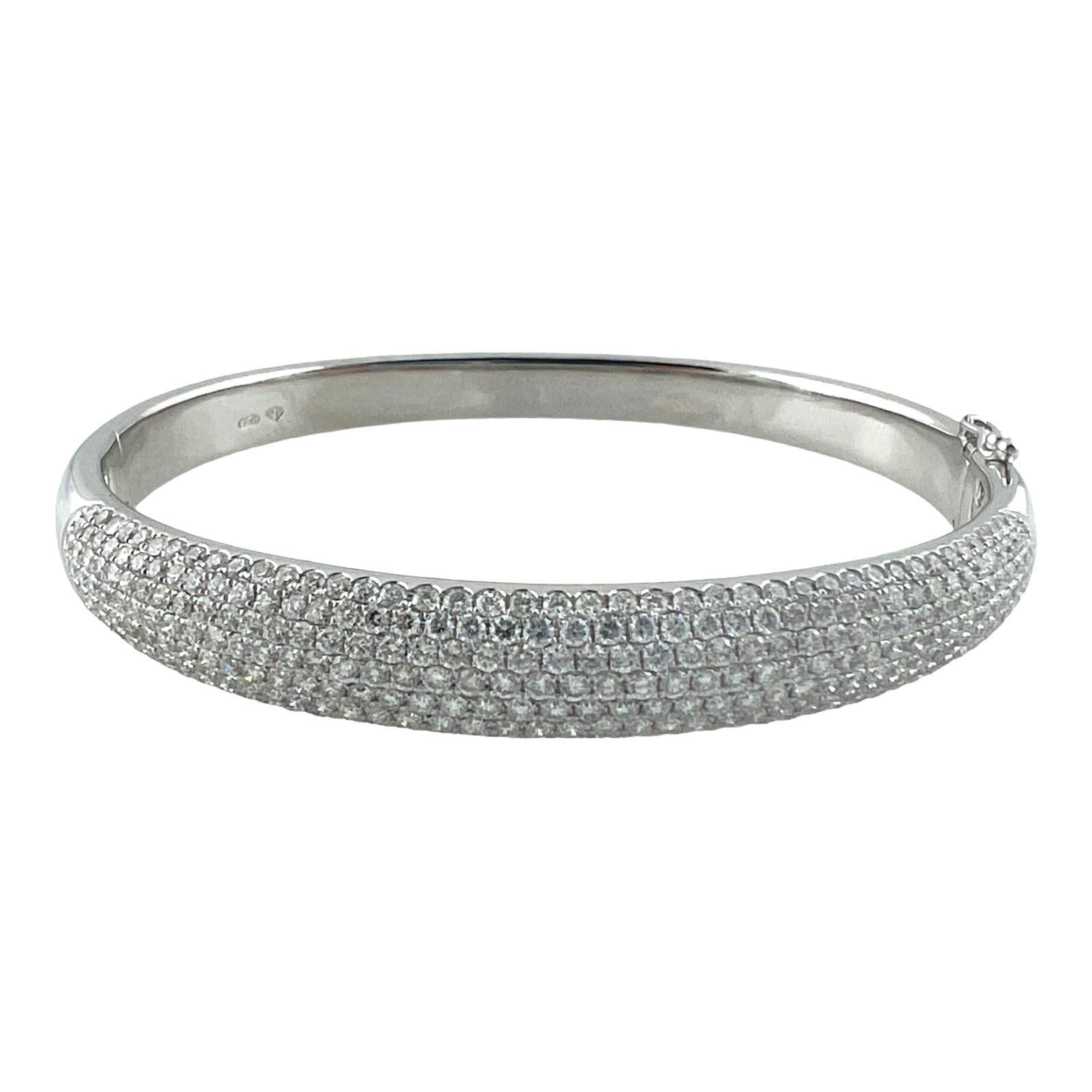Vintage 18 Karat White Gold Diamond Bangle 

This beautiful diamond bangle bracelet is full of sparkle, set with over 300 round brilliant diamonds

Total diamond weight is approx. 4.0 cts. 

Diamond Color - G - H

Diamond Clarity: VS1/VS2 

This