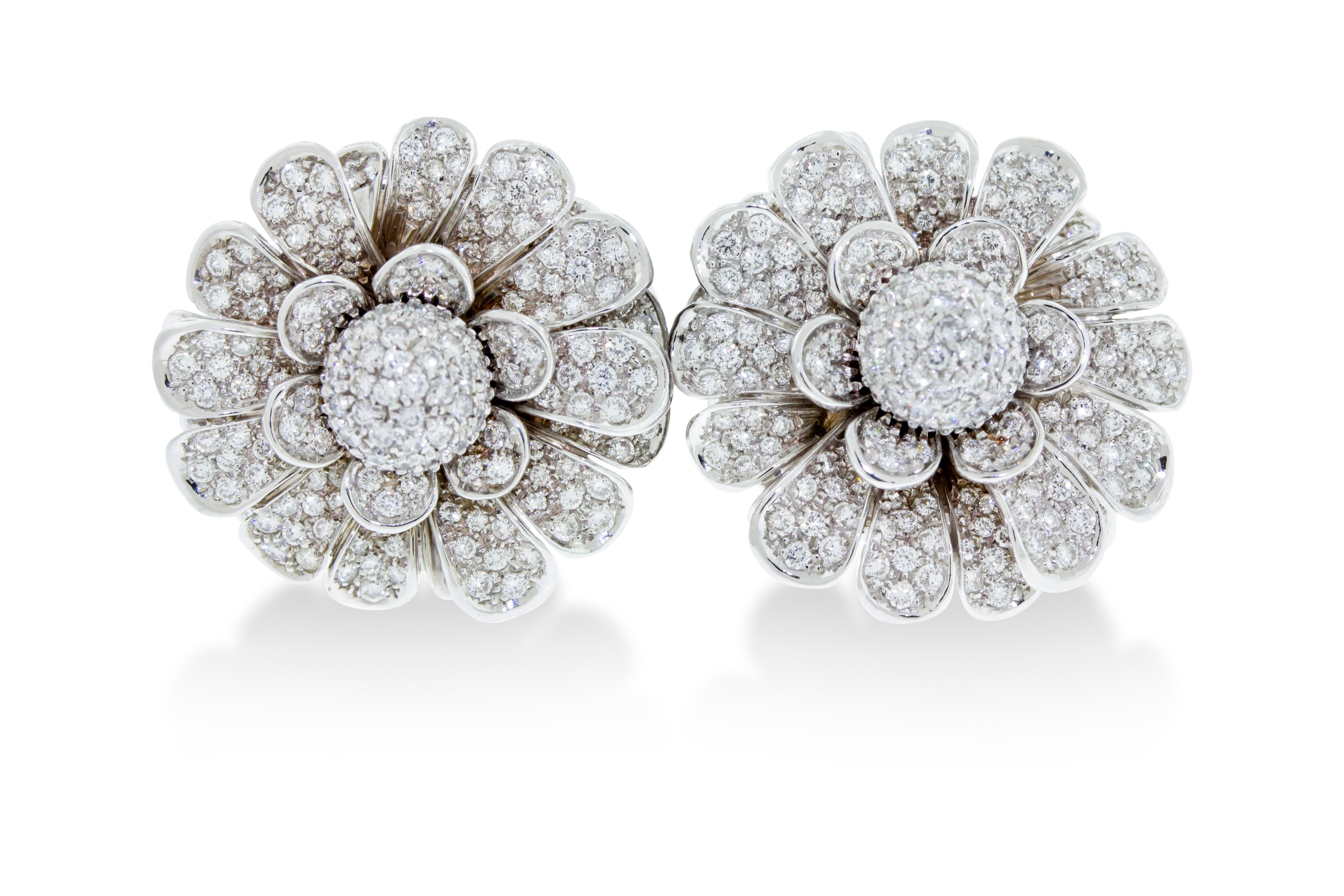 A pair of pave diamond ear clips featuring petals that move mimicking a life like flower. Made in Italy. Set in 44 grams of 18K white gold with a total diamond weight 6 carats. 1.25 inch diameter.

Viewings available in our NYC showroom by