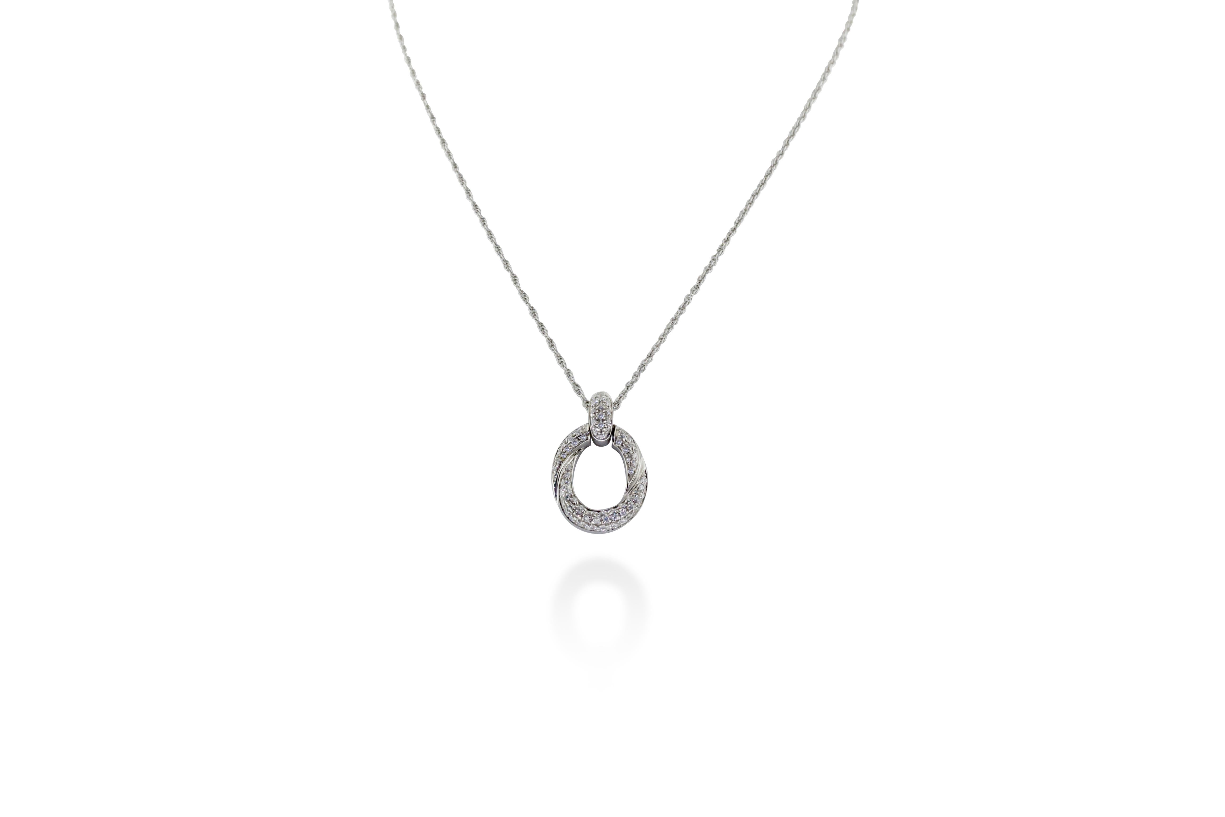 This necklace features an oval shape 18K white gold pendant encrusted in 0.55 carats of G-H VS diamonds. 6 grams of gold. Chain length is approximately 9 inches. Made in Italy. 