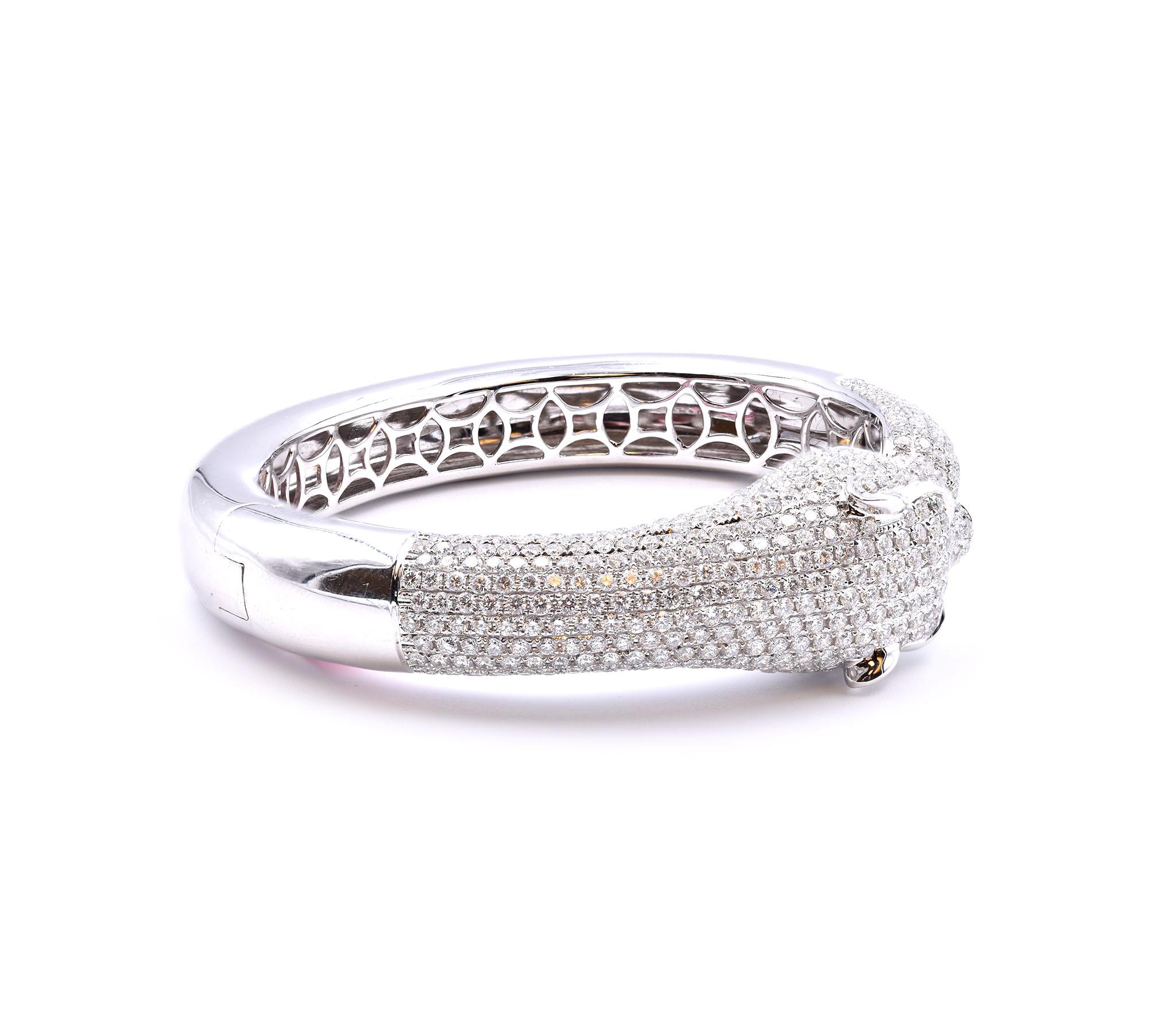 Designer: custom design
Material: 18k white gold
Diamonds: 578 round brilliant cut= 10.40cttw
Color: G
Clarity: VS1
Dimensions: bangle will fit a size 6 ½-inch wrist,  bangle is 11.78mm-18.31mm wide
Weight: 56.42 grams	
