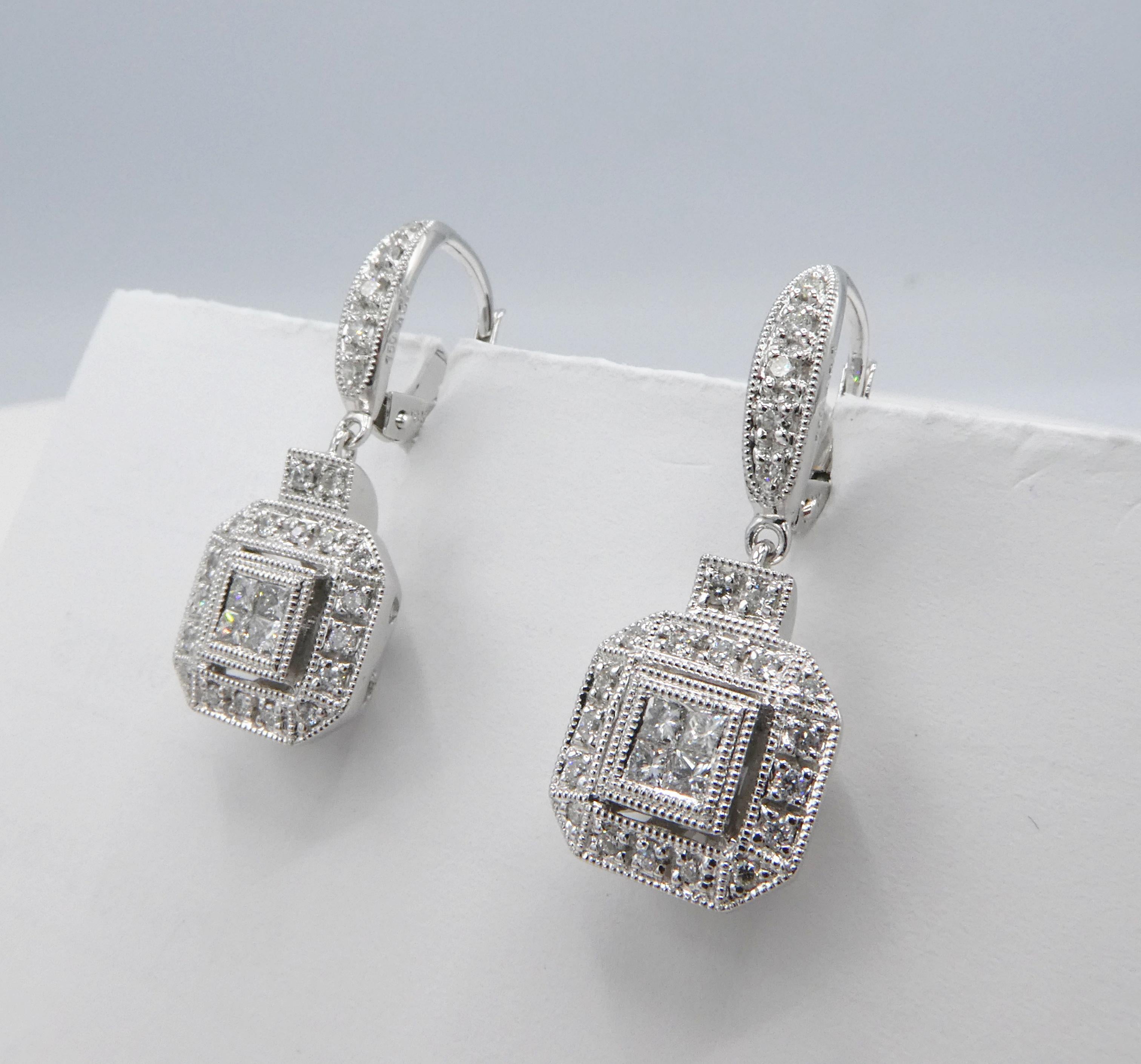 Diamond Square Dangle 18K White Gold Huggie Earrings Cluster Pave Round Diamonds

Metal: 18K White Gold 750
Weight: 6.68 grams
Measures 9.57mm wide and 1 inch long
Diamonds: 8 princess cuts and 46 round diamonds approx. .50 CTW G-H SI
Stamped: 