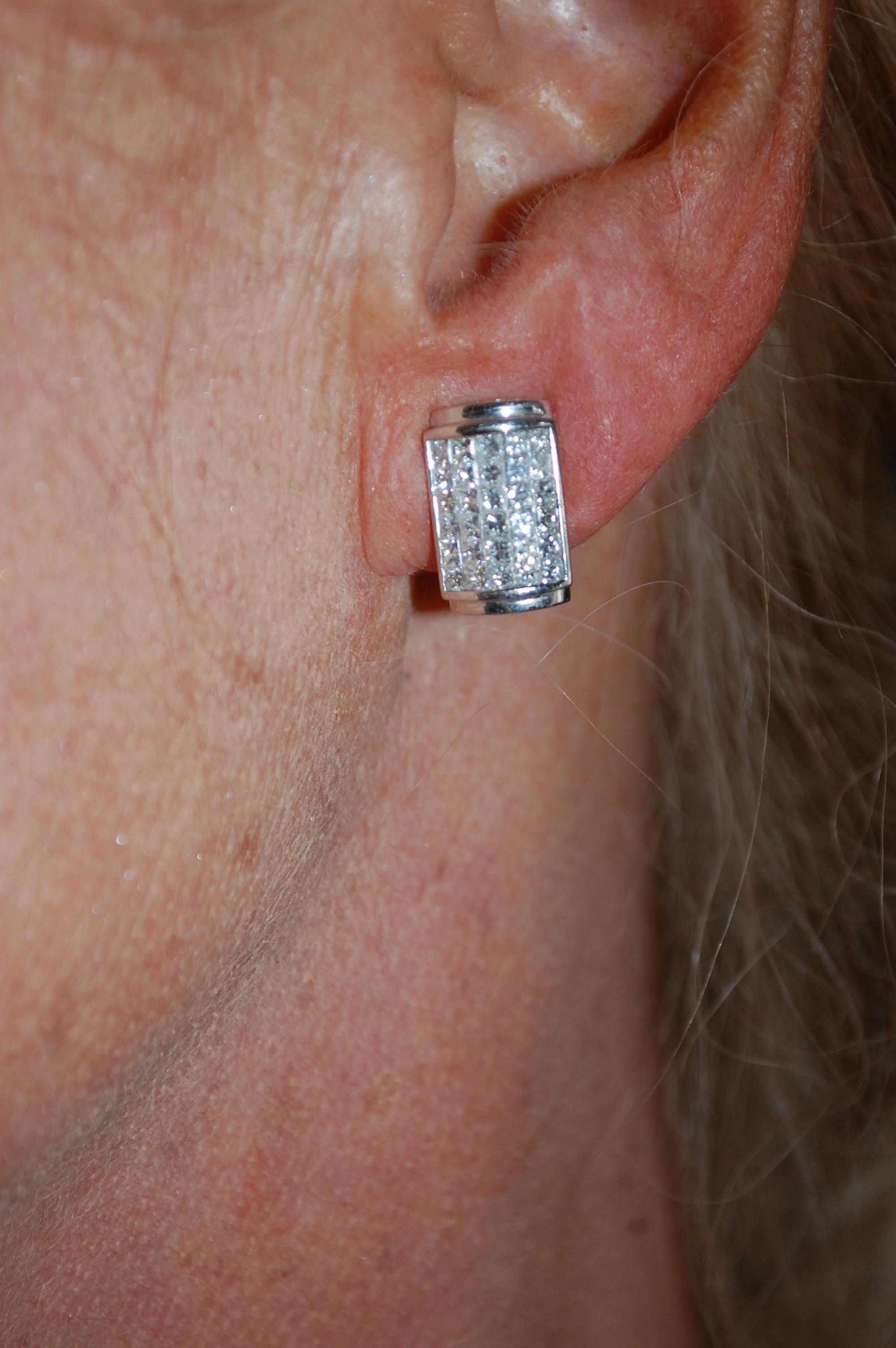 Estate 18k white gold marked 18kg, and 750 M.D.J  Maison De Jewels.  A lovely pair of pave clip on earrings set in 18k white gold. This delightful earrings are invisibly set with each exactly 30 princess cut diamonds which have about 1.5 carat total