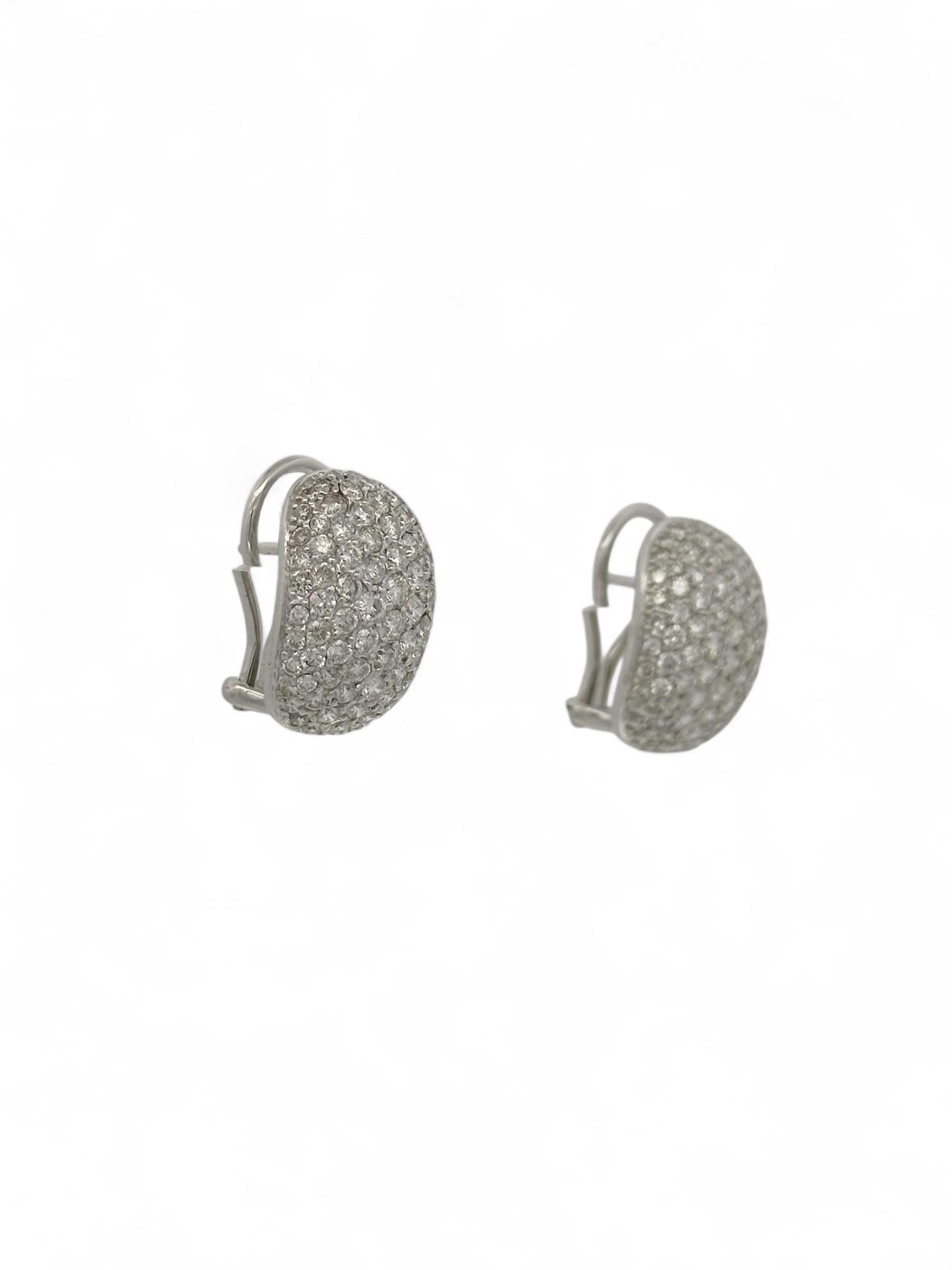 These exquisite 18k white gold Huggie earrings are a stunning blend of elegance and modern sophistication. Each earring is adorned with pave-set diamonds, collectively weighing an total of 3.00 carats. The meticulous setting technique allows every