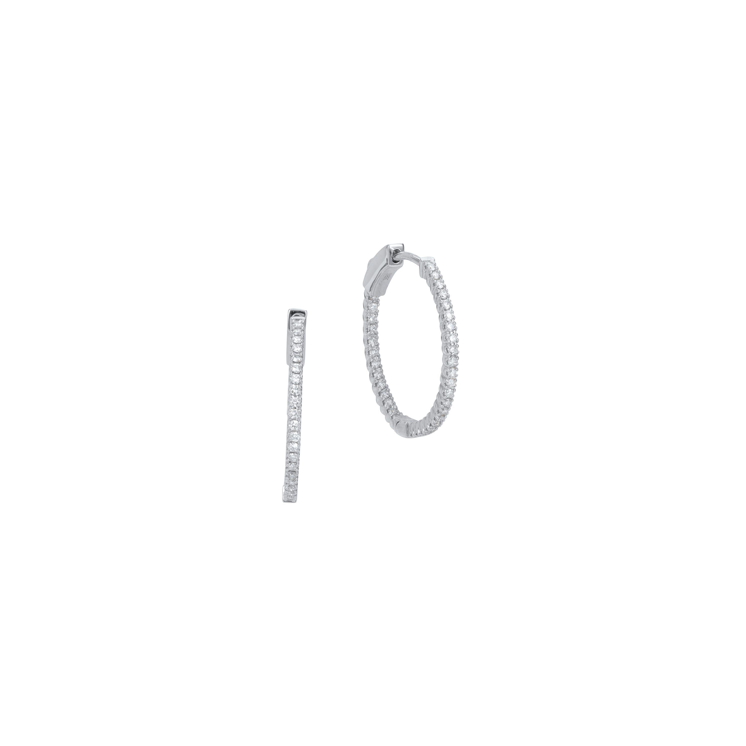 Elegant, timeless, captivating, round brilliant diamond huggie Luxle hoop earrings in 18k white gold, for pierced ears. These elegant earrings feature 68 round brilliant cut diamonds with GH color and I1 clarity are pave set both on the inner and