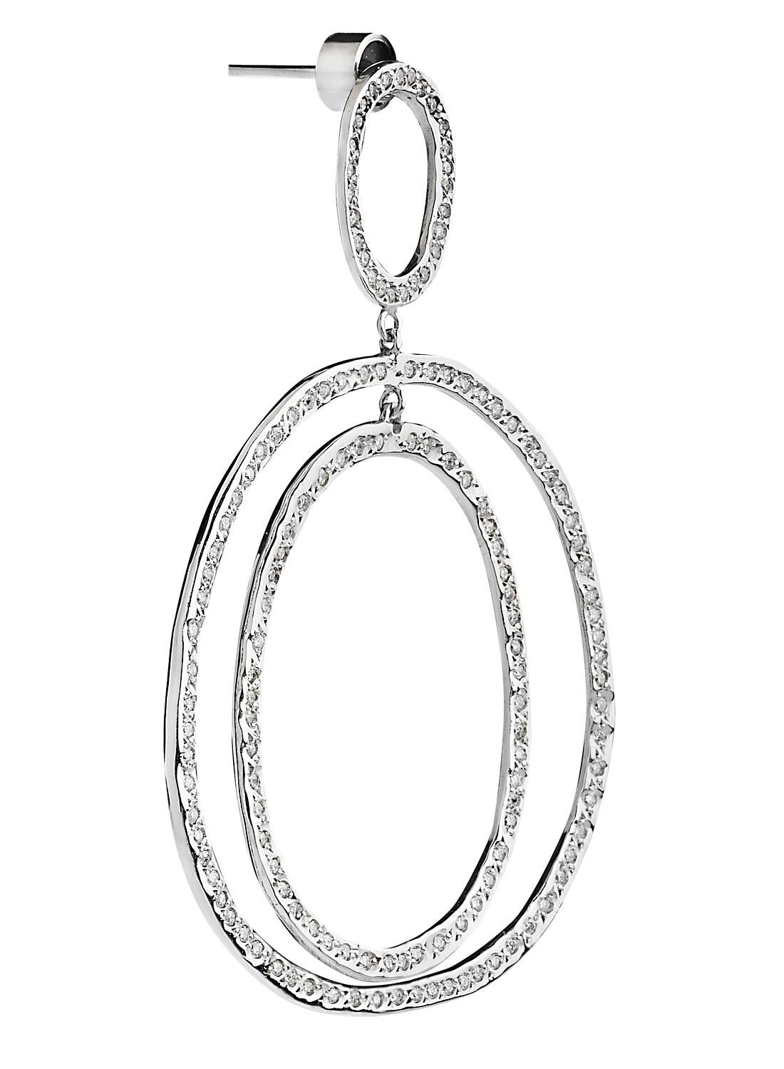 Ileana Makri's Best-Selling Diamond Double hoop Again earrings are handcrafted from 18-karat polished white gold and set with 1.98-carats of pavé white diamonds with a post back for pierced ears. Ileana Makri's Again Collection centers its design