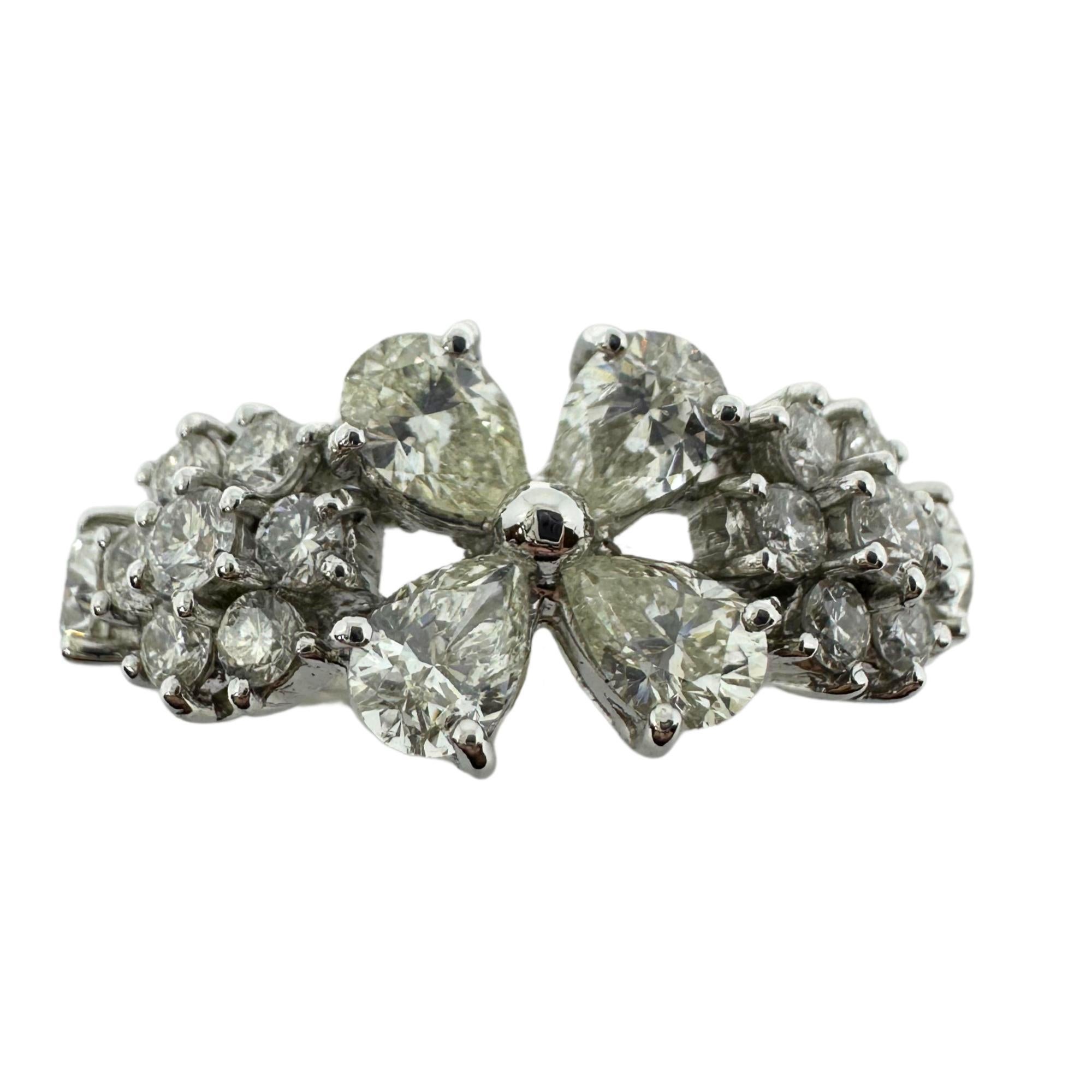 18k White Gold Pear Cut Diamond Ring. The center and sides of the ring has pear cut diamonds with round diamond accents, weighing 2.16 carats total set in 18K white gold. The ring weighs 5.88 grams and is marked 
