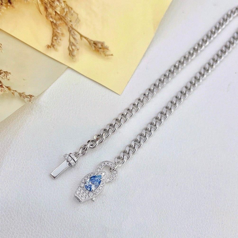 Women's or Men's 18K White Gold Pear-Cut Fancy Blue Diamond Cuban Chain Diamond Bracelet For Sale