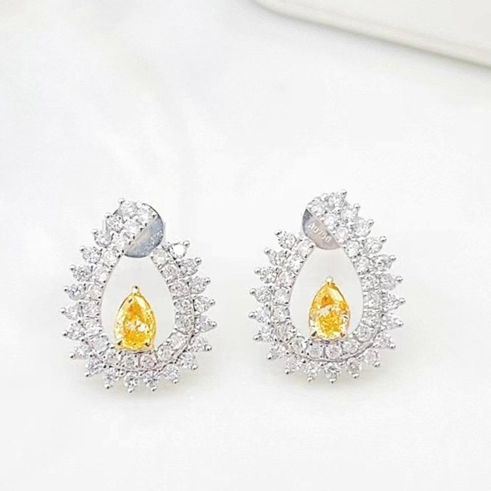 18K White Gold Pear-Cut Fancy Yellow Diamond & Diamond Stud Earrings

2 Fancy Yellow Diamonds - 0.34 CT
Diamonds - 0.70 CT
Total Weight - 2.54 GM

