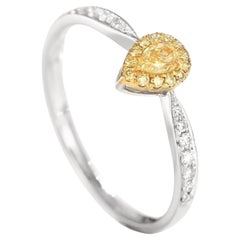 Anillo con diamantes amarillos talla pera de oro blanco de 18 quilates