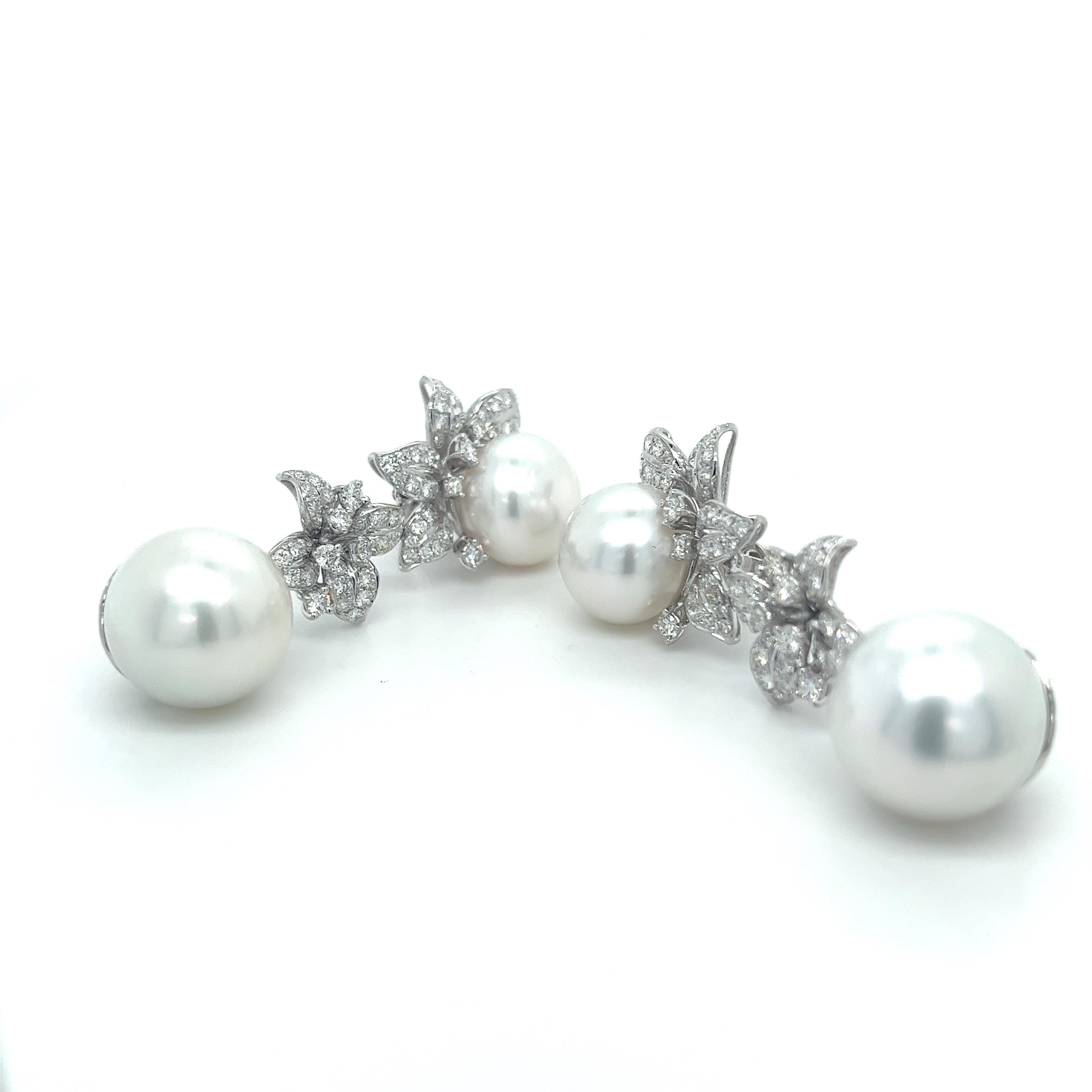 18K White Gold Pearl Earrings with Diamonds

2 White Pearls 15mm
2 White Pearls 13mm
144 Diamonds - 2.580 CT
18K White Gold - 11.540 GM

Indulge in sophistication with Althoff Jewelry 18K White Gold Pearl Earrings. Featuring two lustrous 15mm and