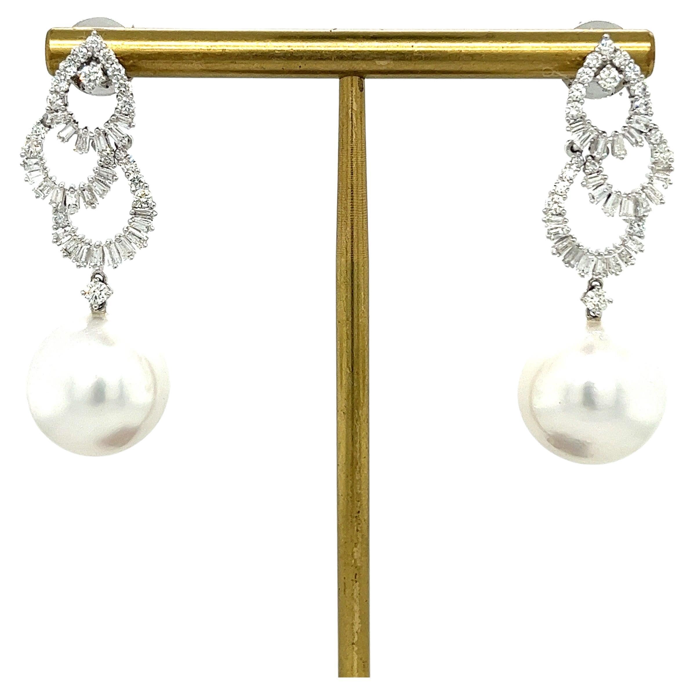 18K White Gold Pearl Earrings with Diamonds

2 White Pearls 14-15 mm
84 Diamonds - 1.89 CT
18K White Gold 5.61 GM

Althoff Jewelry exquisite 18K white gold earrings are adorned with two lustrous white pearls, each measuring 14-15 mm in diameter. The