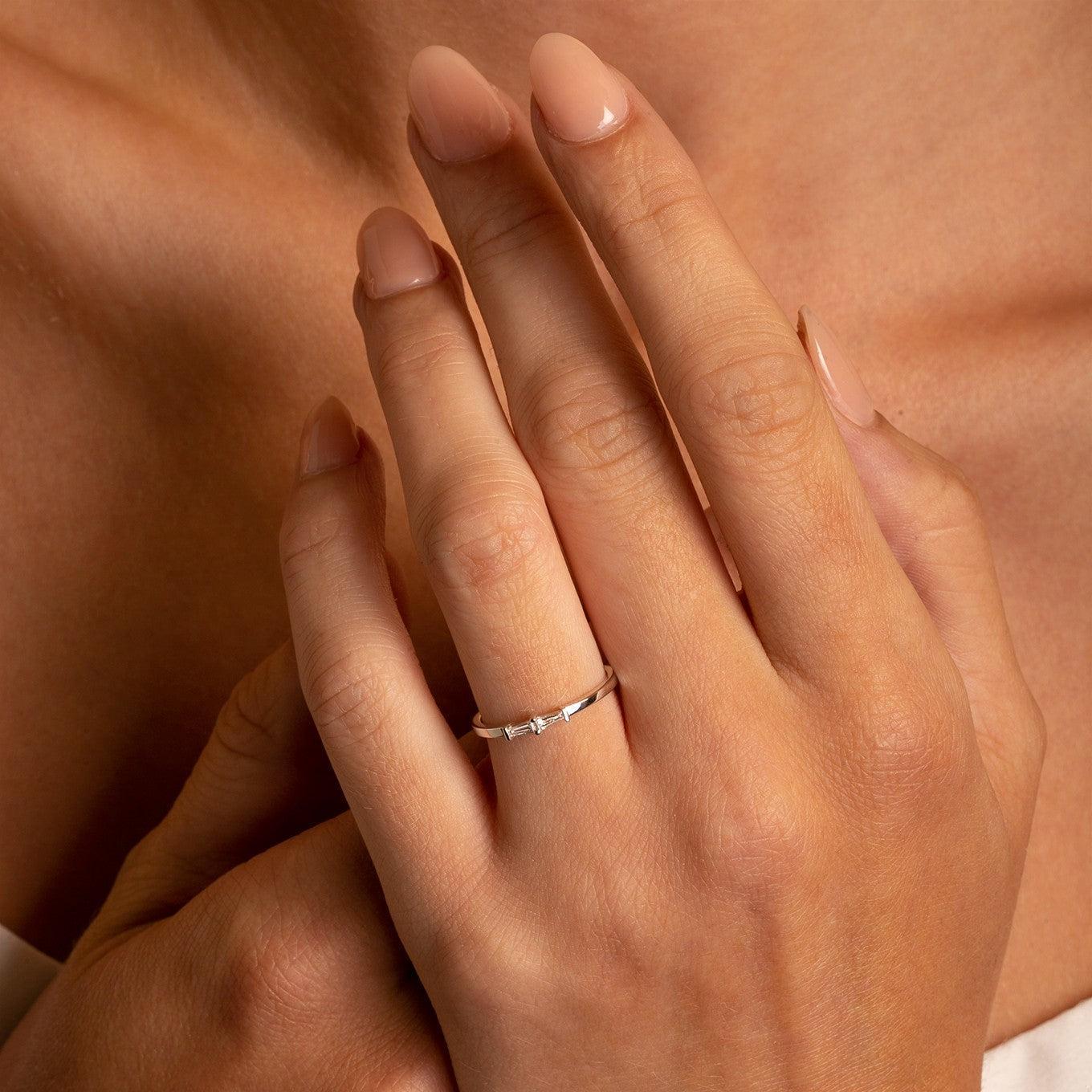 Elevate your everyday style with the 18K Gold Petite Double Baguette Diamond Stacking Band.

Crafted from luxurious 18K gold with two striking baguette-cut diamonds.

Perfect for adding a touch of sophistication to any look.

Petite design ideal for