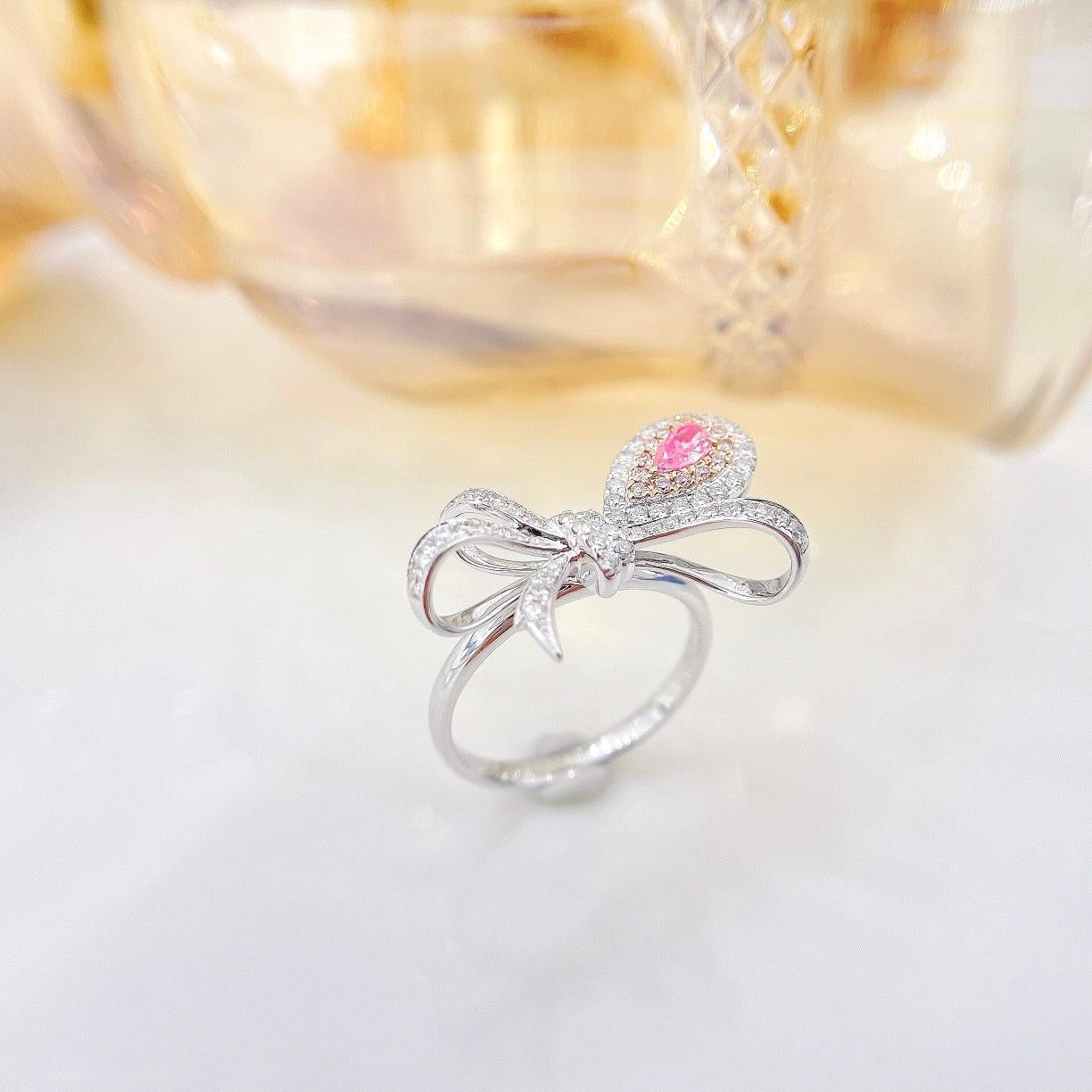 18K White Gold Pink Diamond Bow Ring with Diamonds

1 Pink Diamond - 0.12 CT
Diamonds - 0.40 CT

Total Weight - 4.2 GM