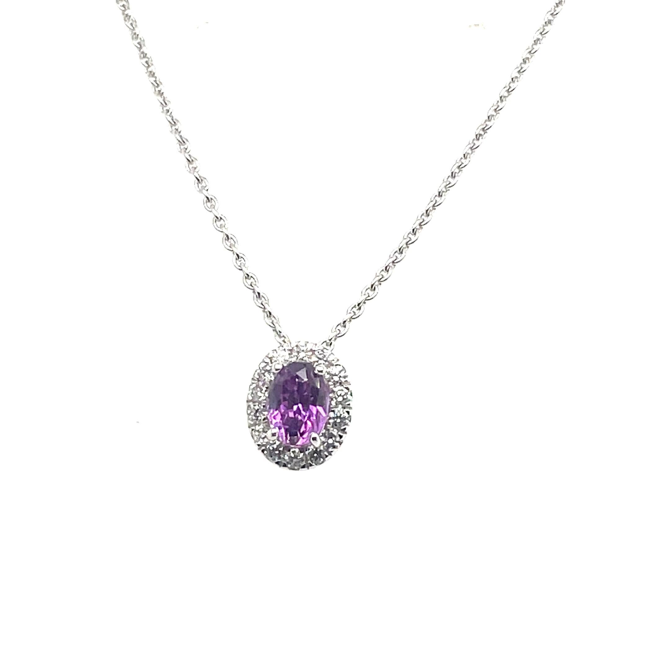 Set in shiny 18k white gold and weighing just 1.04 grams with its chain, this pendant feels light but looks luxurious. 

The center stone is a 1.45-carat pink-purple sapphire, known for symbolizing wisdom and loyalty. 

It comes from Sri Lanka, a
