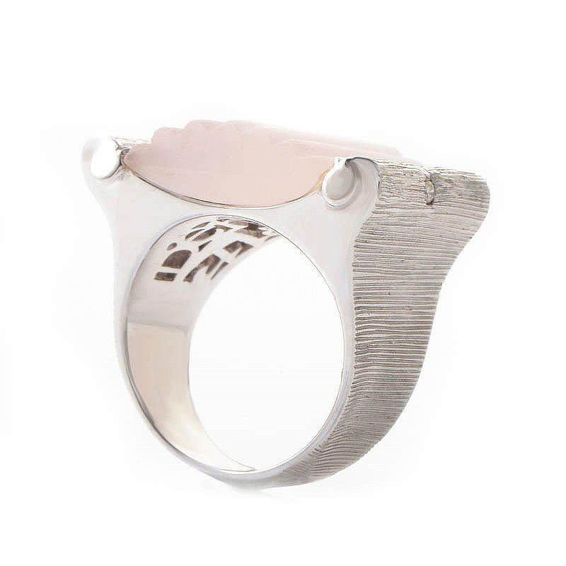 This ring is feminine and exotic. The setting is made of 18K white gold and boasts a large pink quartz accent. Lastly, the quartz is accented with ~.10ct of diamonds.
Ring Size: 7.25