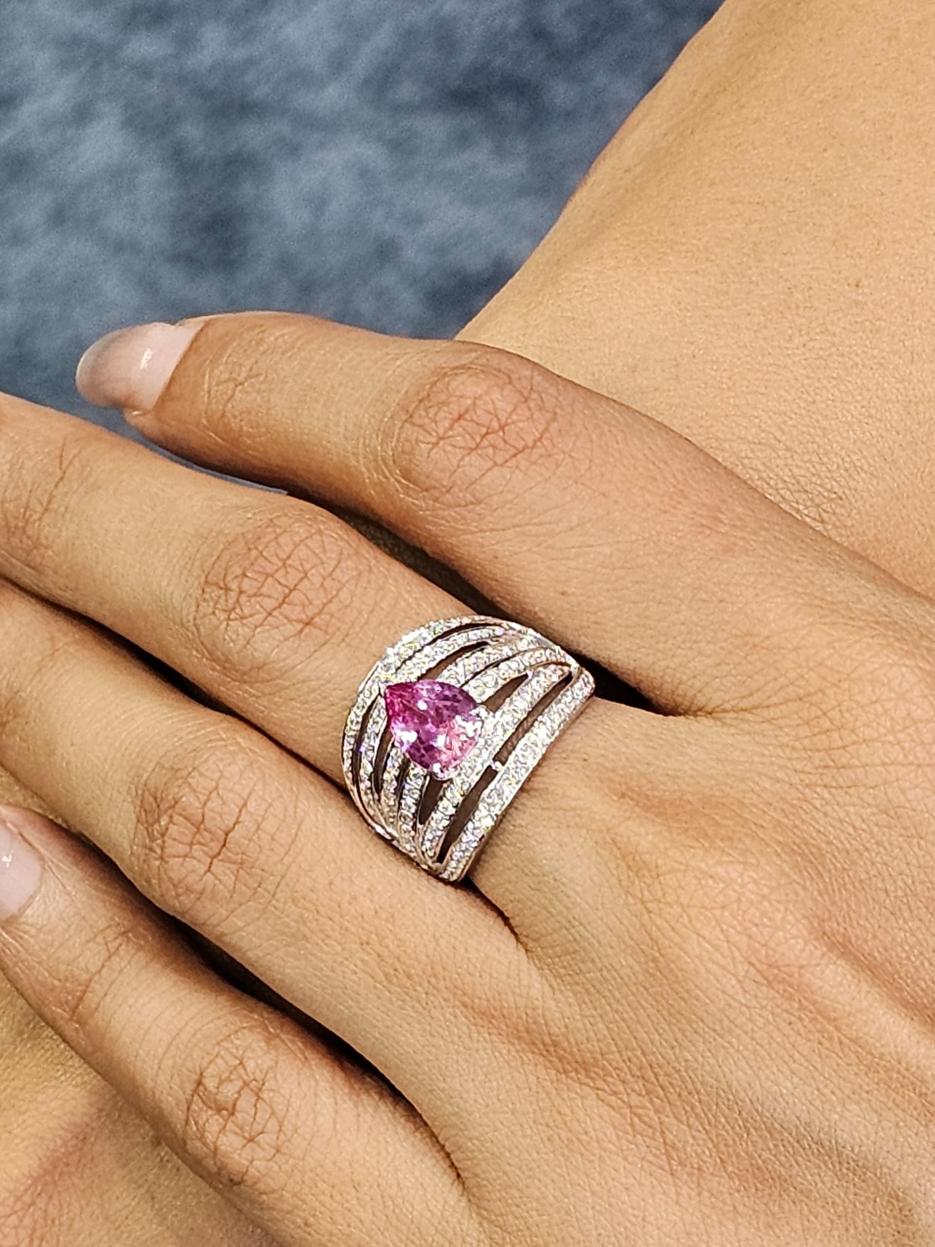 A romantic fusion of color and brilliance, this exquisite dress ring features vibrant pink sapphire and dazzling white diamonds set in luxurious 18K white gold. The soft, feminine hue of the pink sapphires evokes grace and charm, while the diamonds