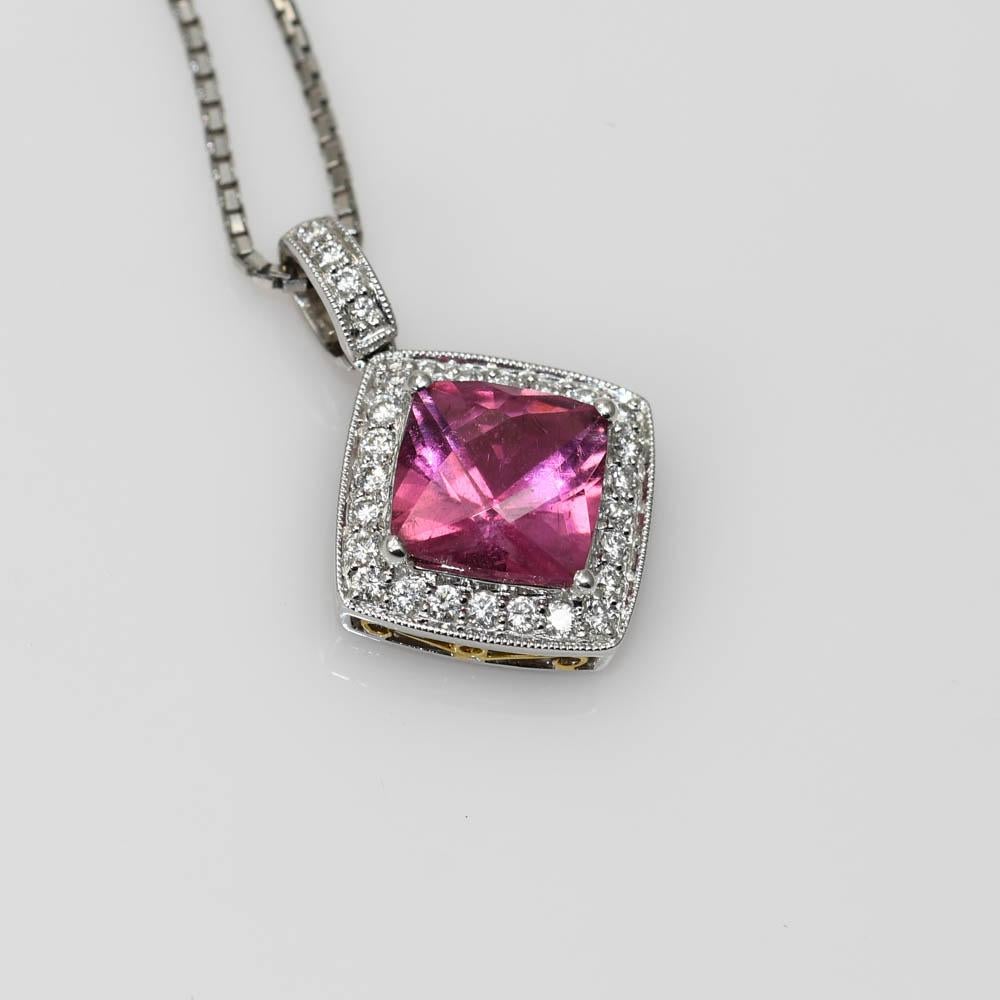 Simon G designer necklace with pink tourmaline and diamond pendant set in 18k white and yellow gold.

Stamped 18k and 2.16 for the tourmaline weight. Also, there is the designers serial number stamped on the back.

The natural pink tourmaline is a