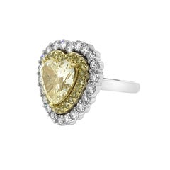 18 Karat White Gold and Platinum 4.65 Carat Yellow Heart Shape Diamond Ring