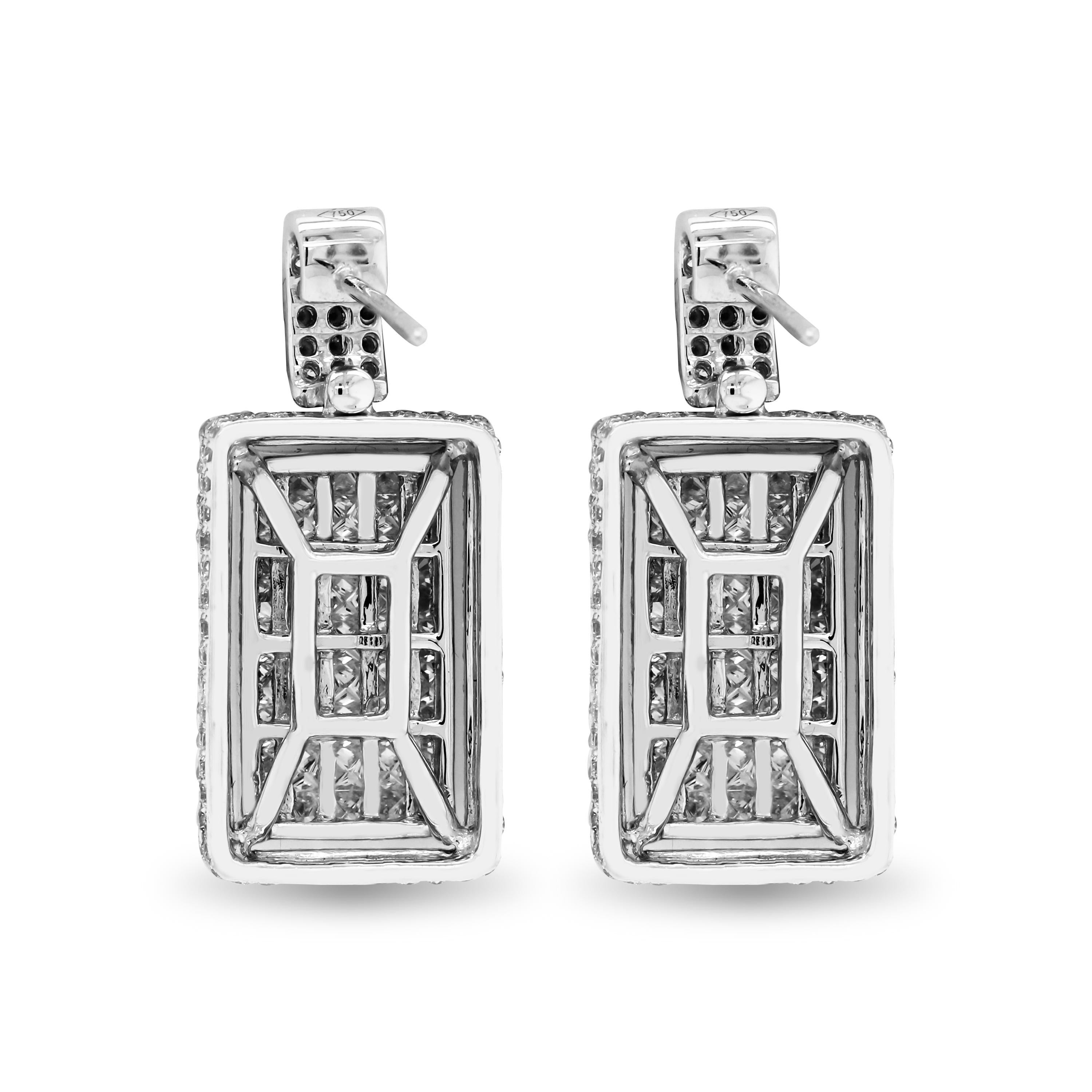 18K White Gold Princess and Round Cut Diamond Drop Earrings

These beautiful earrings feature two rectangle shape drops with princess and round cut diamonds with a three-row diamond top

4.87 carat G color, VS clarity diamonds total weight

Earrings