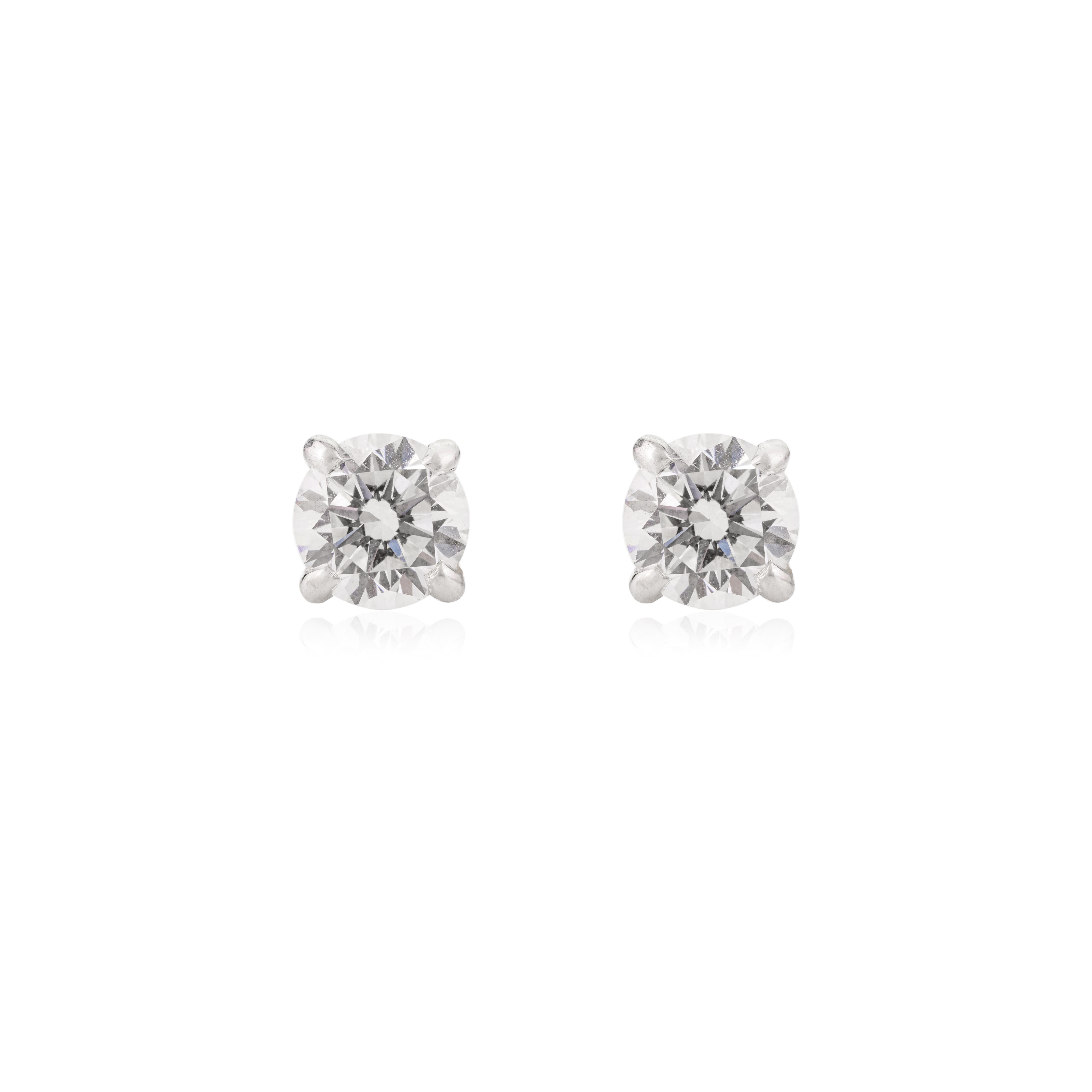Round Cut Fine Moissanite Prong Stud Earrings in 18k solid white gold. You shall need these stud earrings to make a statement with your look. These Moissanite stud earrings create a sparkling, luxurious look featuring 2.12 carats of
