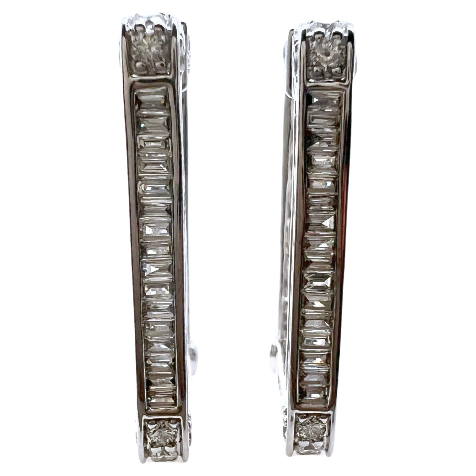 This is an amazing pair of diamond earrings.  The rectangular shape gives it a more fresh, modern look with diamonds on the inside, outside, and even on the side. Making it 3 sides of diamonds.  The baguettes are channeled set with a round brilliant