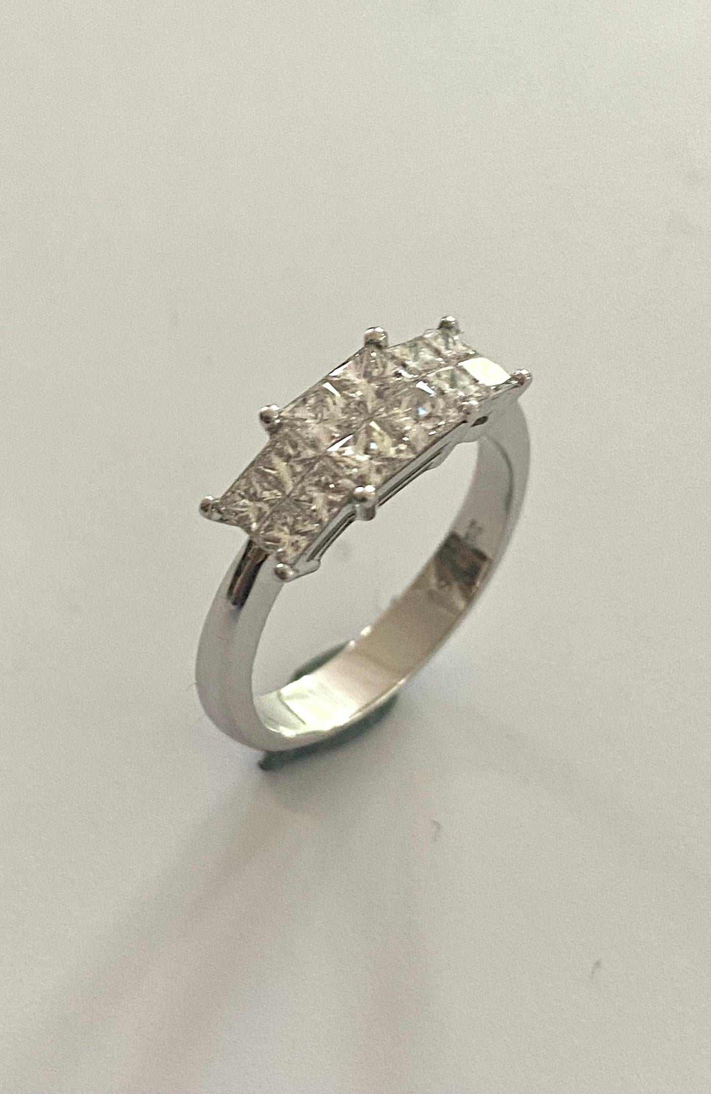 An 18K. white gold ring. classic model set with 12 princess cut diamonds weighing together ± 1.19 ct.
Quality: VVS Color: F-G
Weight: 4.68 grams
size: 17.5 (55) USA: 7 UK: O
top ring size: 16 x 6 x 4 mm
