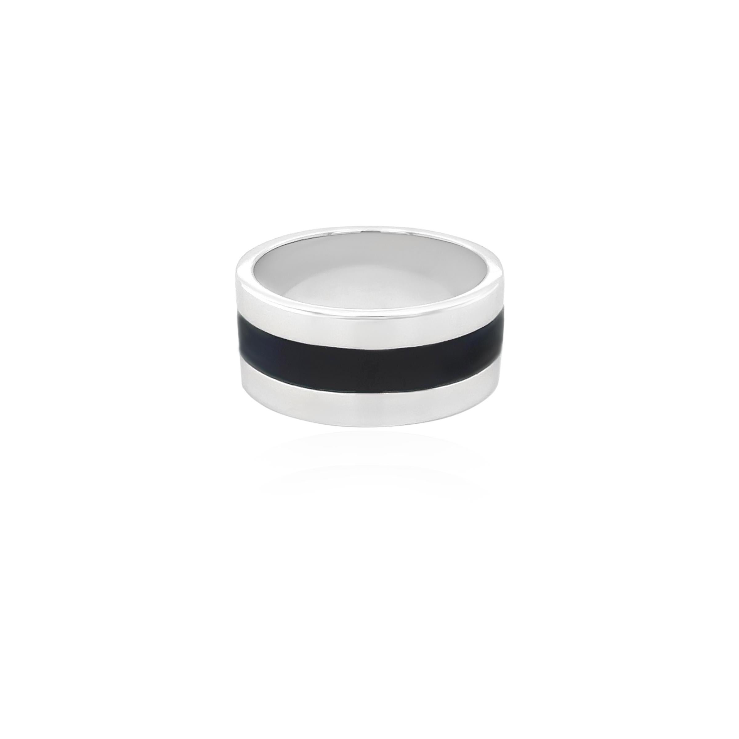 This 18k white gold men's ring features a sleek strip of black enamel running down the center, complemented by three small round diamonds set delicately along the band. The striking contrast between the polished white gold, the bold black enamel,
