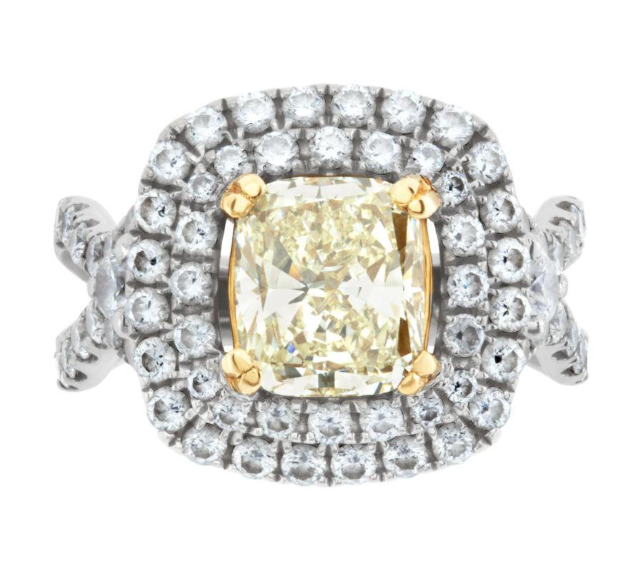 GIA certified cushion modified brilliant cut diamond 2.03 carat (M color, SI1 clarity) ring set in 18k white gold setting with approximately 1.50 carats in G-H color, VS-SI clarity diamond accents and 22k yellow gold basket for a Fancy Yellow look.